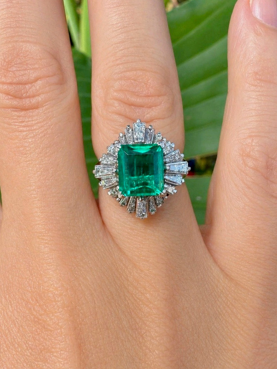 Estate Ring, 20 Baguette Cut Diamonds 1.09ct H-J VS1-VS2, 1 Emerald Emerald Cut 2.65ct Green Columbia Minor Modern, Platinum 11.52g. All Weights Estimated.