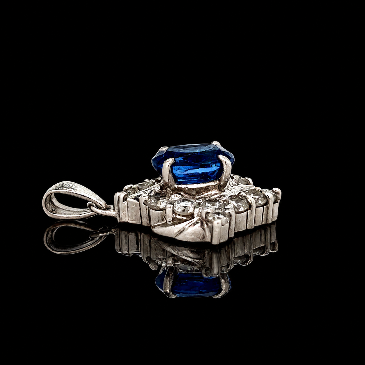 Estate Pendant, Round Brilliant Cut Diamond 0.61 cttw  G-H VS2-SI1,1 Sapphire Oval 1.46 ct  Platinum 3.23g. All Weights Estimated.