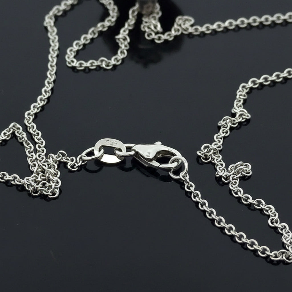 Dyach Necklace, Round Brilliant Cut Diamond 1.15cttw, 1 Tanzanite Trillion Cut 4.04ct, 14K/18K White Gold 8.46g. All Weights Estimated.