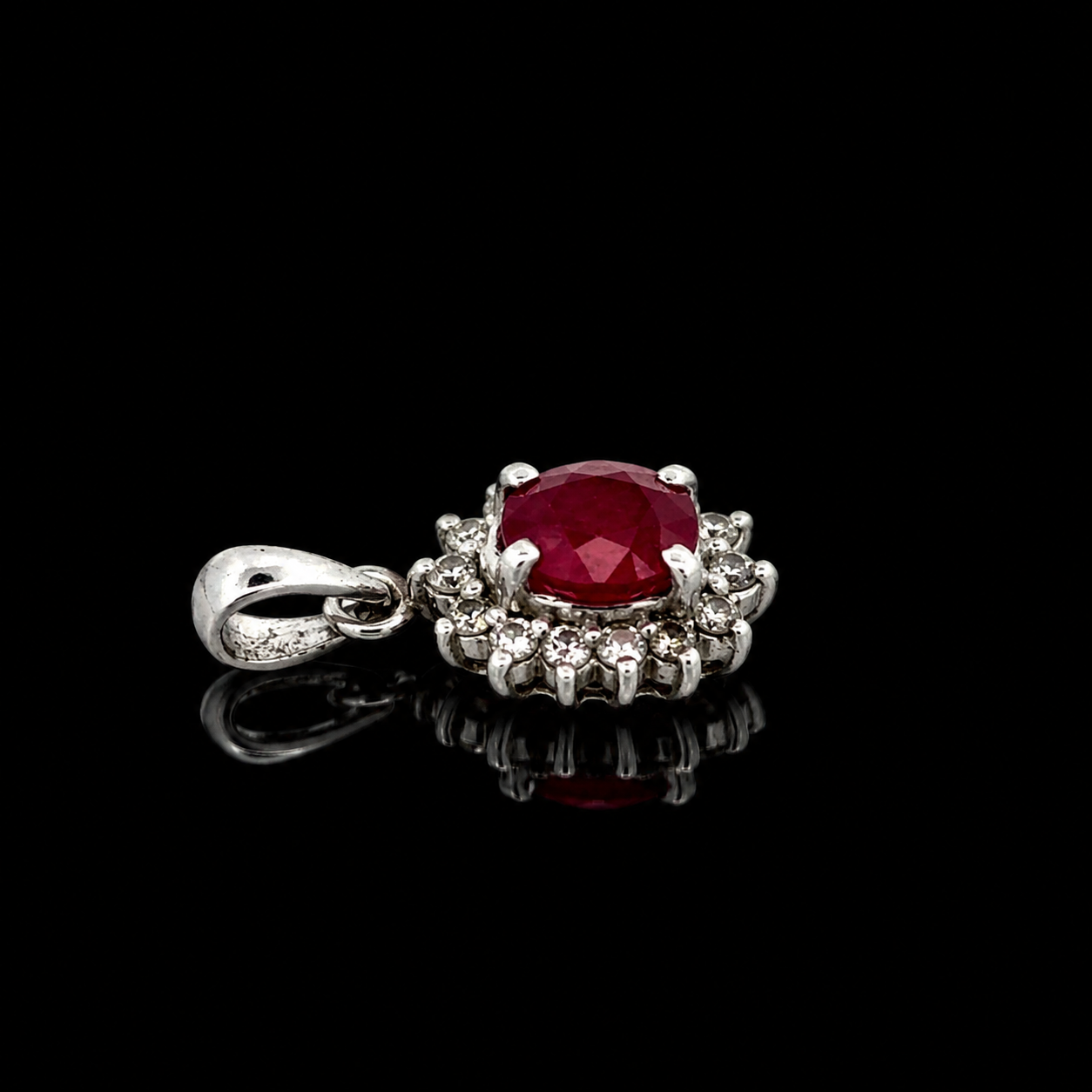 Estate Pendant, Round Brilliant Cut Diamond 0.20 cttw  G-H SI1-SI2,1 Ruby Oval 1.00 ct  Platinum 2.23g. All Weights Estimated.