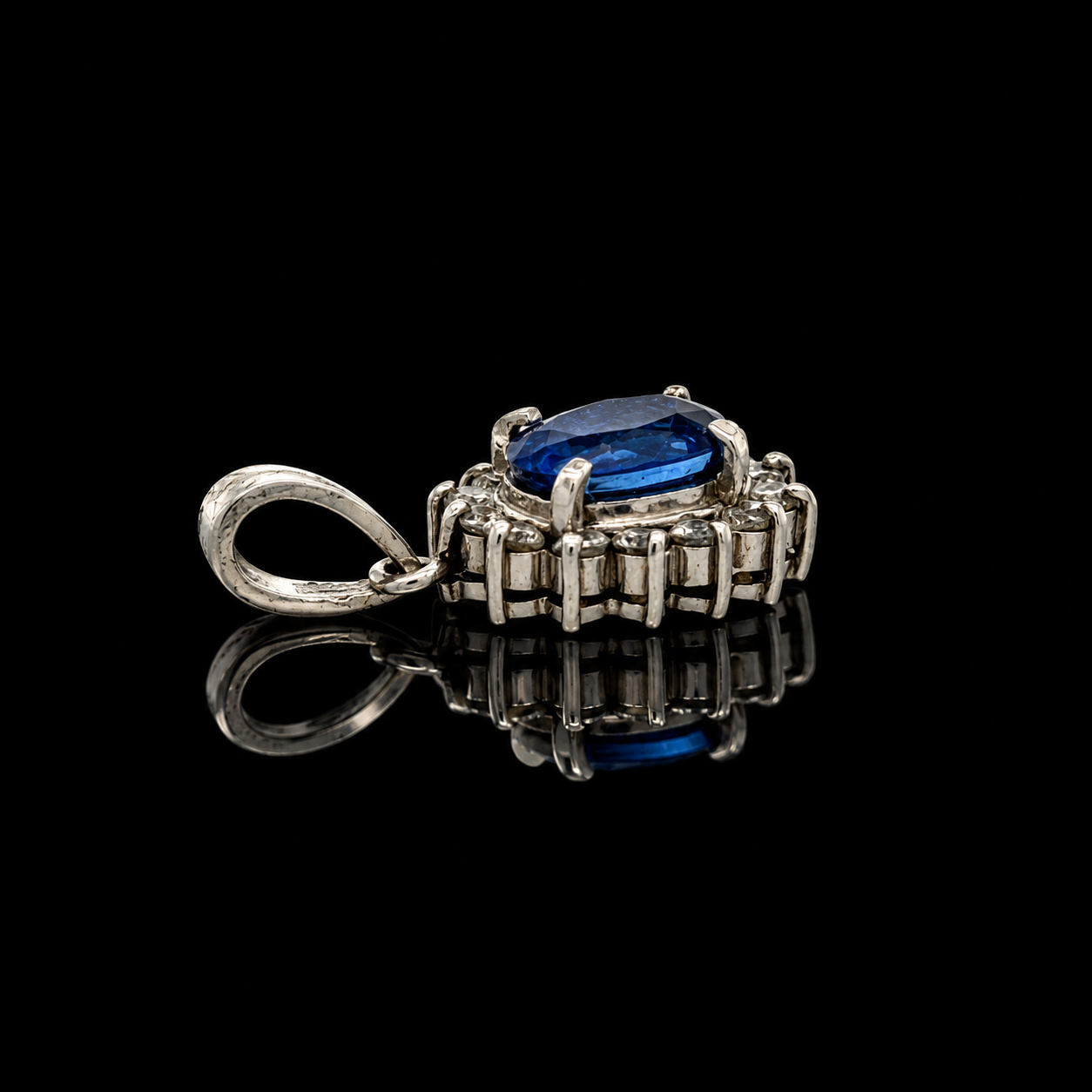 Estate Pendant, Round Brilliant Cut Diamond 0.33 cttw  G-H VS1-SI1,1 Sapphire Oval 1.68 ct  Platinum 26.10g. All Weights Estimated.
