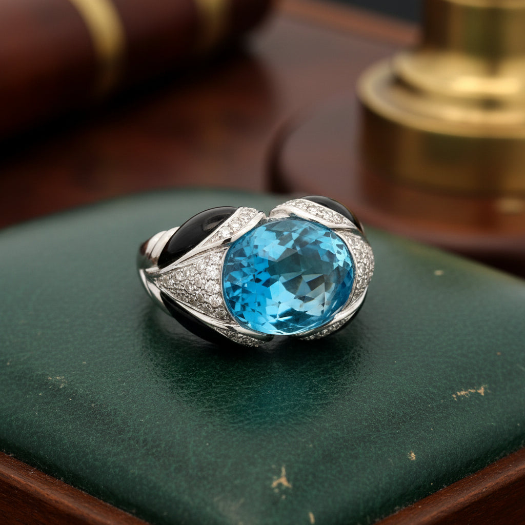Italian Ring, Round Brilliant Cut Diamond 0.52cttw, G-H VS2-SI1,1 Blue Topaz Fancy Cut 5.00ct, 4 Carved Onyx 18K White Gold 14.57g. All weights estimated.