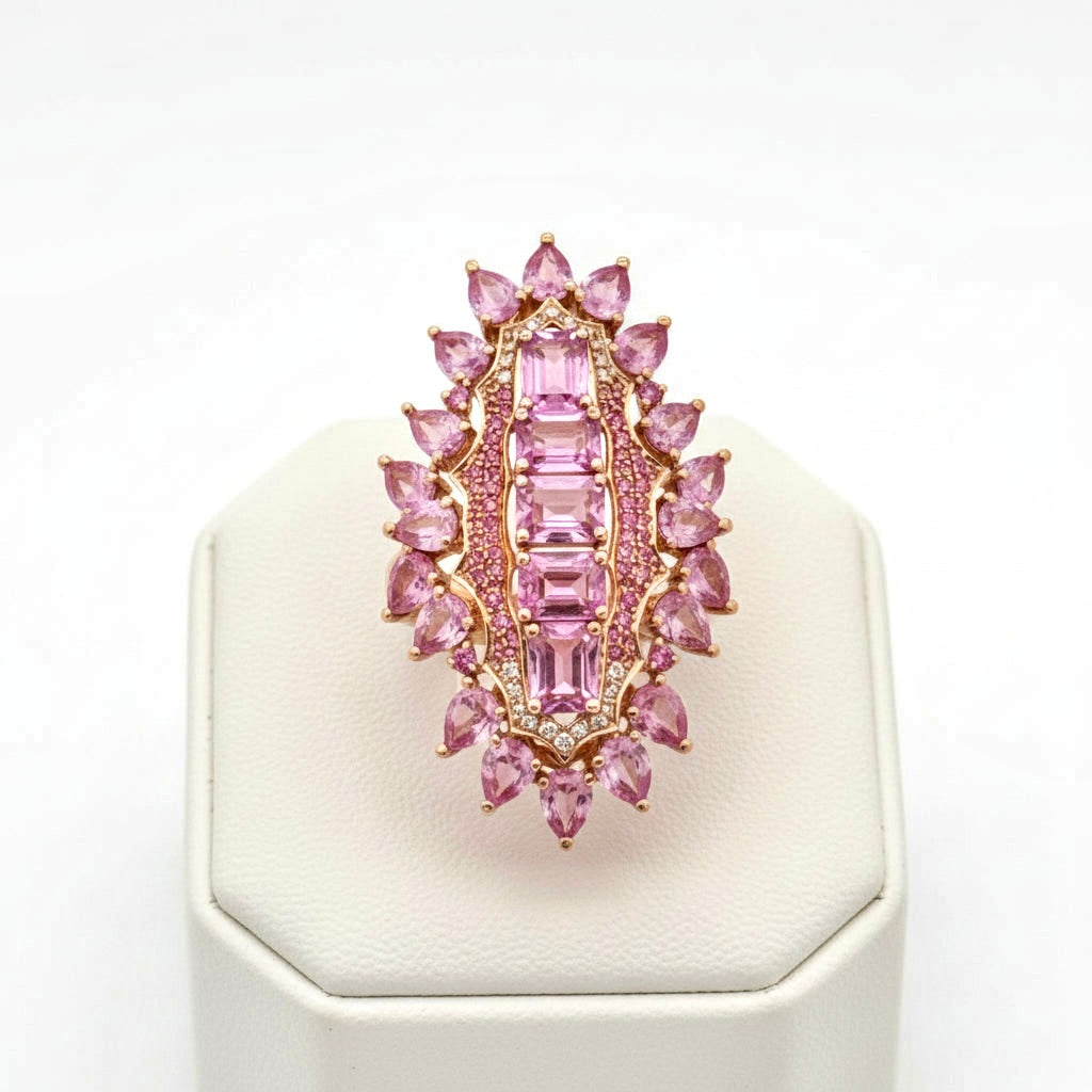 Ring, Round Brilliant Cut Diamonds 0.50cttw H-I SI1-SI2, 25 Pink Sapphires Pear/Round/Emerald Cut 6.50cttw, 14K Rose Gold 9.17g. All Weights Estimated.