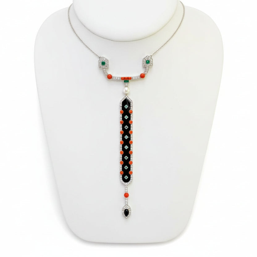  Necklace, 107 Round Brilliant Cut Diamond 1.10 cttw  G-H VS1-VS2,1 Onyx Carved 0.40 ct ,9 Onyx Carved 6.46 cttw ,12 Emerald Mixed Cut 0.51 cttw ,20 Coral 1.40 ct ,1 Cultured Pearl 18K White Gold 20.11g. The chain is 18"