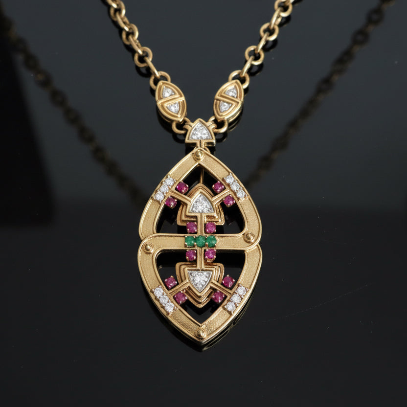 Custom Designer "MJI" Necklace, 33 Round Brilliant Cut Diamond 2.40cttw.  F-G VVS2-VS1,12 Ruby Cabochon 2.16cttw. ,3 Emerald Cabochon 0.39cttw.  18K Yellow Gold 146.01g  All Weights Estimated