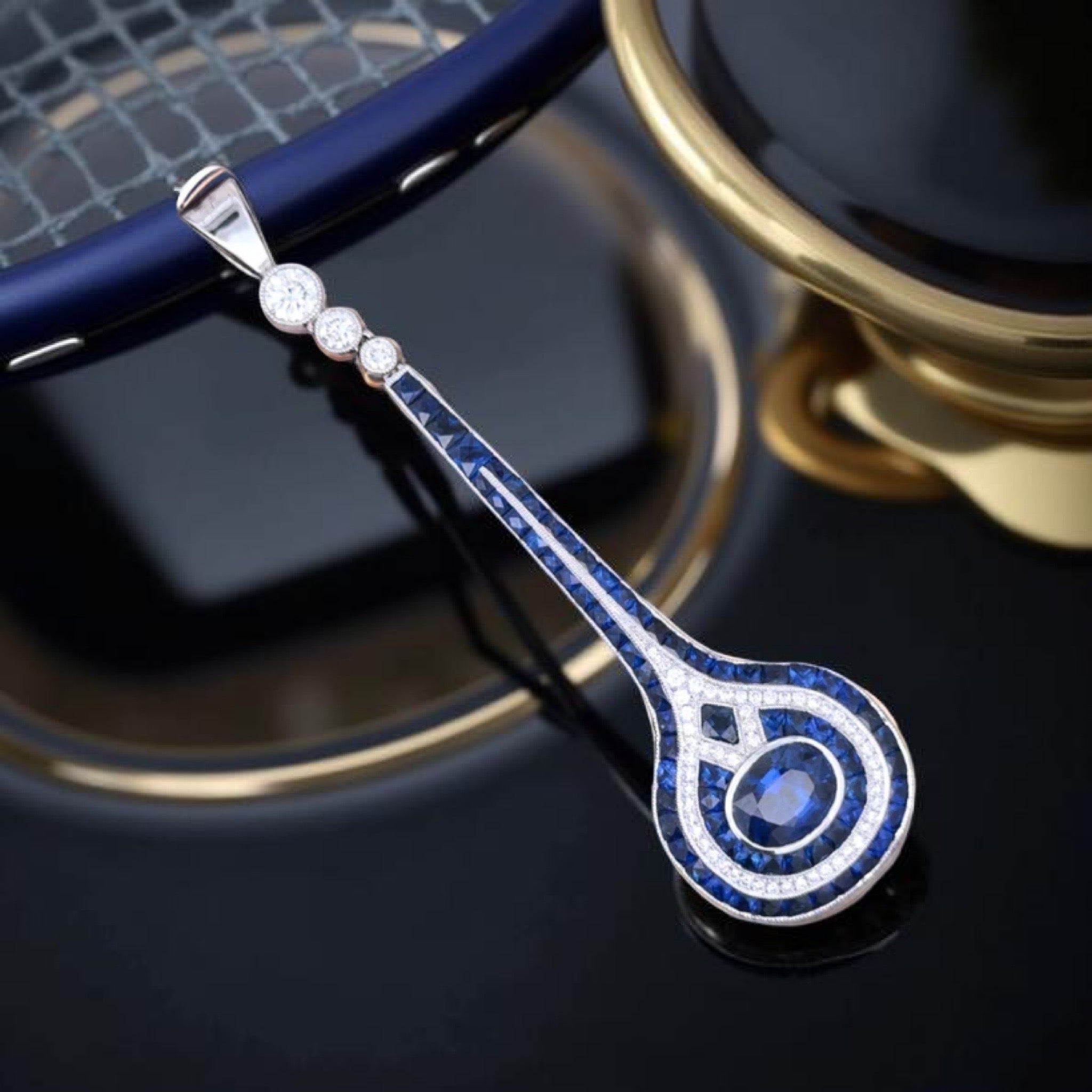 Aristocrat Pendant, 1 Sapphire Oval 2.15 ct  Ceylon-Fine, 71 Sapphire French Cut 3.70 cttw  Ceylon-Fine, 56 Round Diamond 0.50 cttw  G-H VS1-SI1, 18K White Gold 6.62g