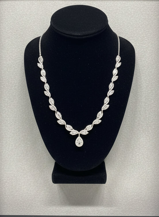 Estate Necklace, 1 Pear Shape Diamonds 1.15ct I-J VS2-SI1, Round/Baguette Cut Diamonds 5.00cttw H-I VS1-SI, Platinum 48.00g. All Weights Estimated.