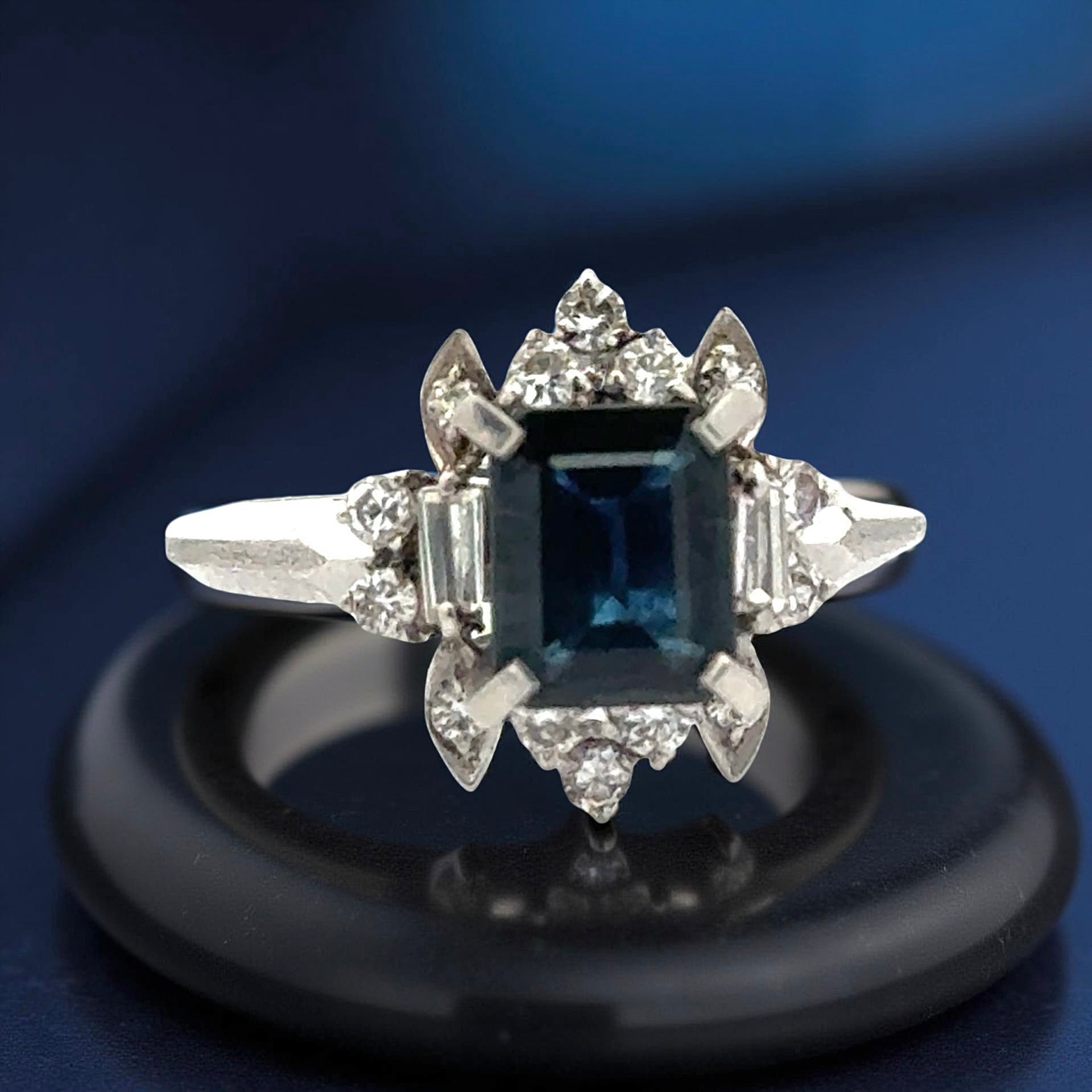 Estate Ring, 16 Mixed Cut Diamond 0.36 ct  H-I SI1-SI2,1 Sapphire Emerald Cut 1.10 ct  Platinum 5.71g