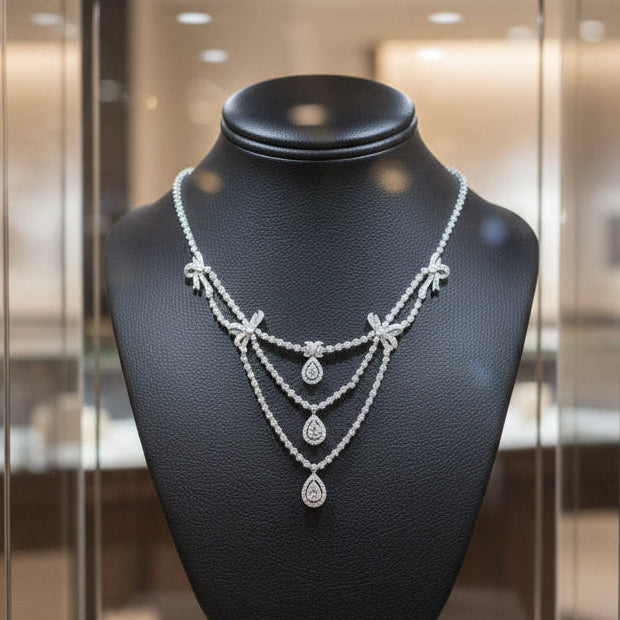 AKMS Necklace, RBC/Pear Diamonds 11.00cttw G-I VS2-SI2, 18K White Gold 38.60g. All Weights Estimated.
