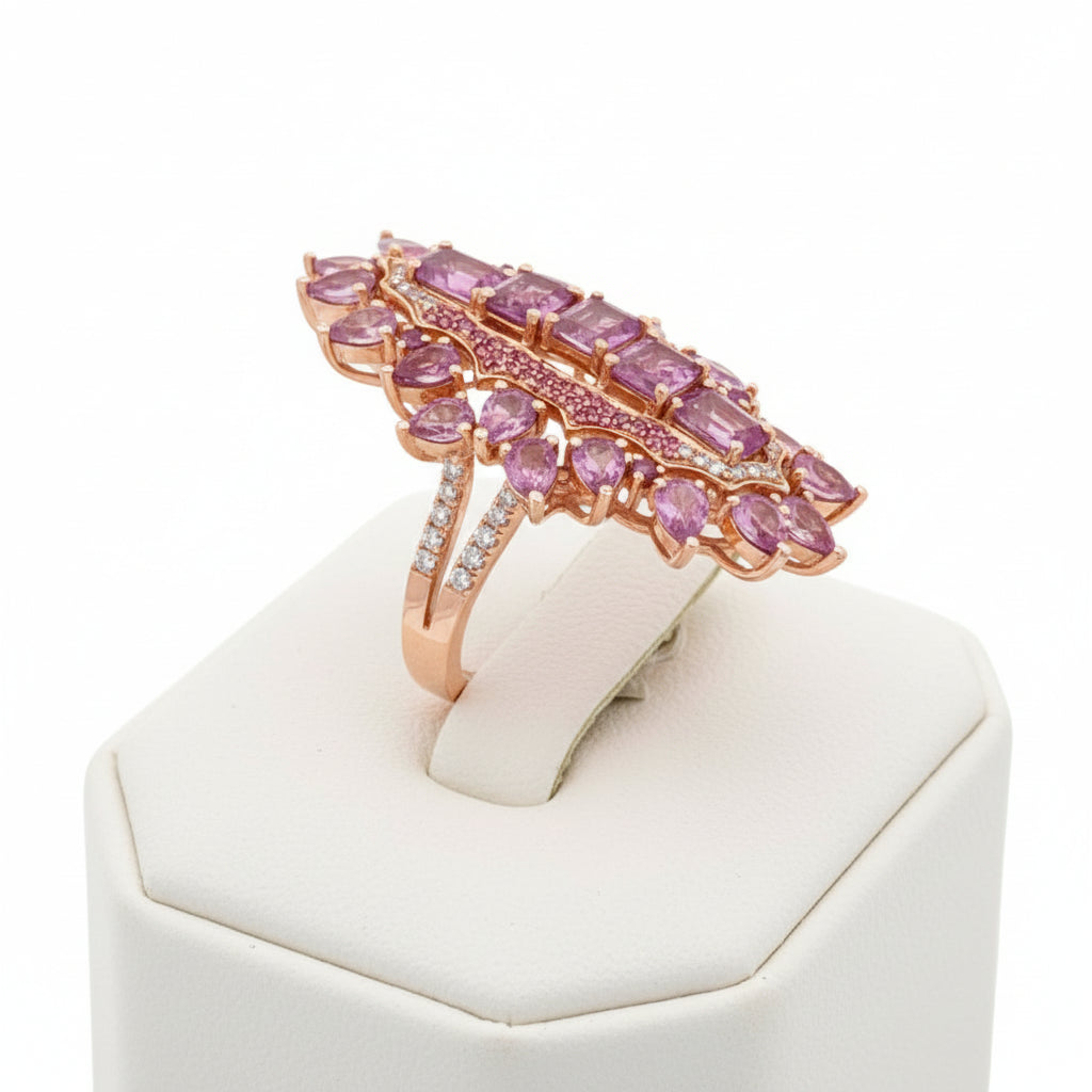 Ring, Round Brilliant Cut Diamonds 0.50cttw H-I SI1-SI2, 25 Pink Sapphires Pear/Round/Emerald Cut 6.50cttw, 14K Rose Gold 9.17g. All Weights Estimated.