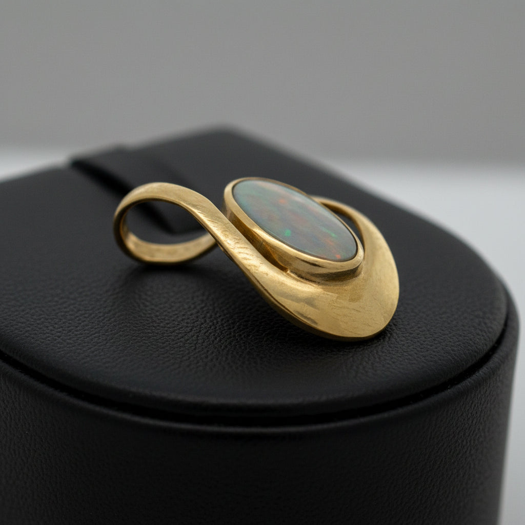 Simon Golub Pendant, 1 Black Opal 5.50ct, 18K Yellow Gold 5.70g, All Weights Estimated.