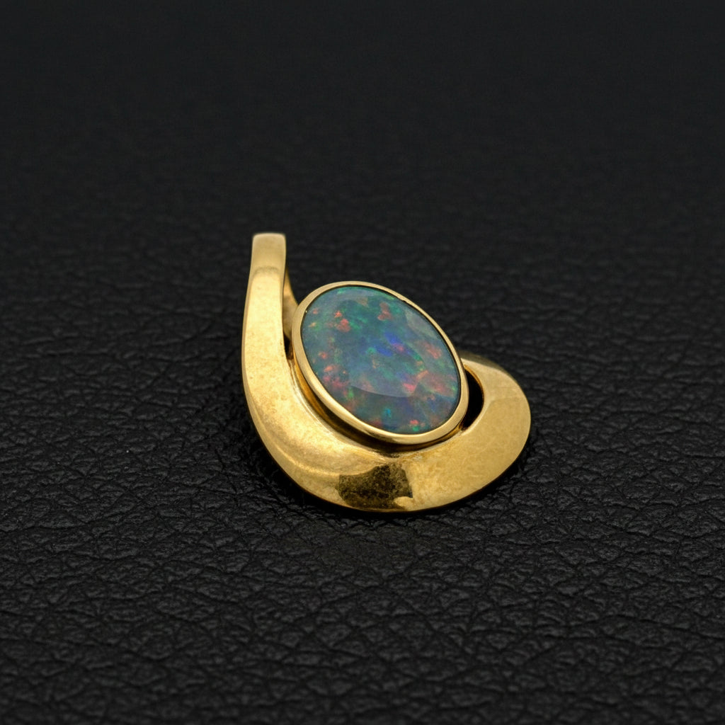 Simon Golub Pendant, 1 Black Opal 5.50ct, 18K Yellow Gold 5.70g, All Weights Estimated.