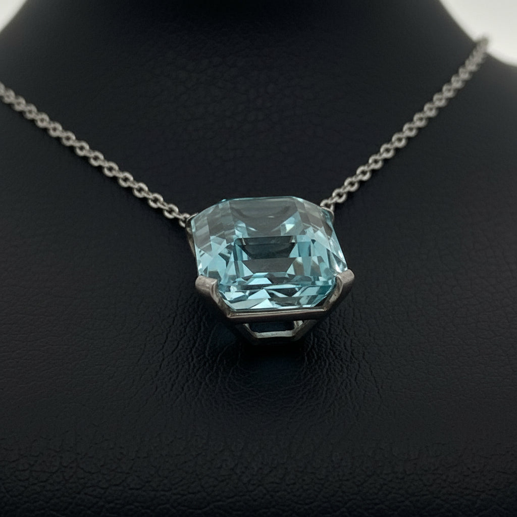 Necklace, 8 Round Brilliant Cut Diamonds 0.16cttw G-H VS2-SI1, 8 Sapphire Round 0.10cttw, 1 Aquamarine Emerald Cut 32.00ct, Platinum/14K White Gold 18.00g. All Weights Estimated.