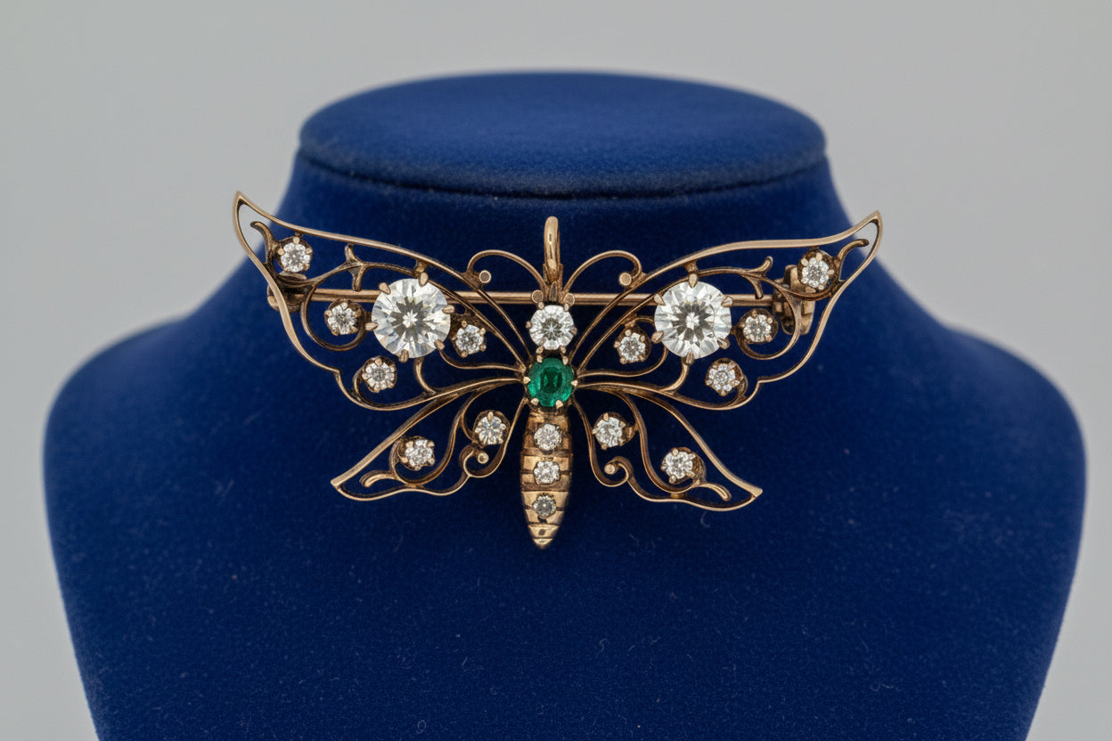 Brooch/Pendant, 1 Old European Cut Diamond 0.66ct I SI2, 1 Old European Cut Diamond 0.77ct H I1, 16 Old Mine Cut Diamond 0.60cttw H-I SI1, 1 Emerald Round 0.10ct, 14K Yellow Gold 8.45g. All Weights Estimated.