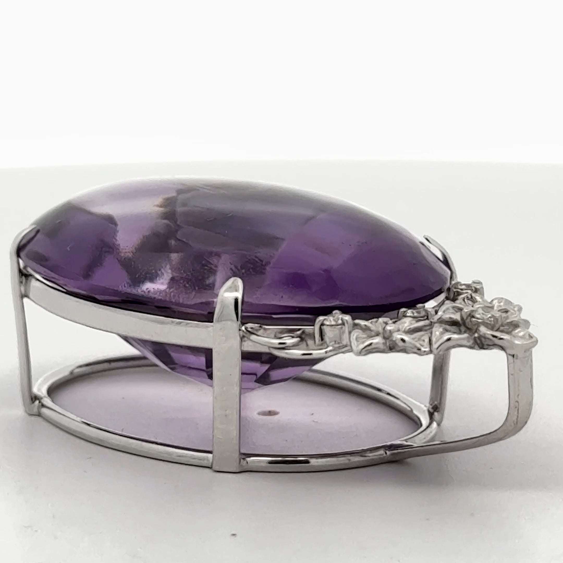 Pendant, 4 Round Brilliant Cut Diamonds 0.08cttw H-I SI1-SI2, 1 Amethyst Cabochon 58.41ct, 18K White Gold. All Weights Estimated.