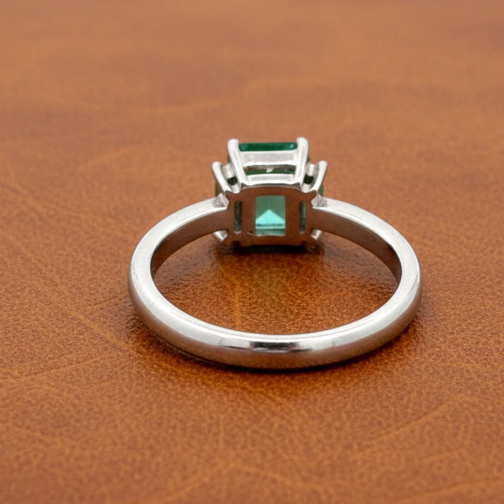 Estate Ring, 2 Baguette Cut Diamond 0.12 cttw H-I VS,1 Emerald Emerald Cut 0.81 ct  Platinum 5.50g (All Weights Estimated)