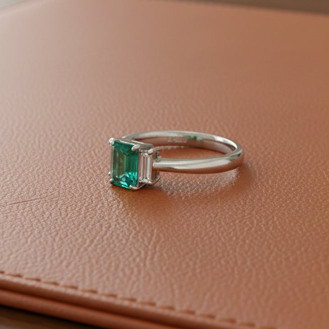 Estate Ring, 2 Baguette Cut Diamond 0.12 cttw H-I VS,1 Emerald Emerald Cut 0.81 ct  Platinum 5.50g (All Weights Estimated)