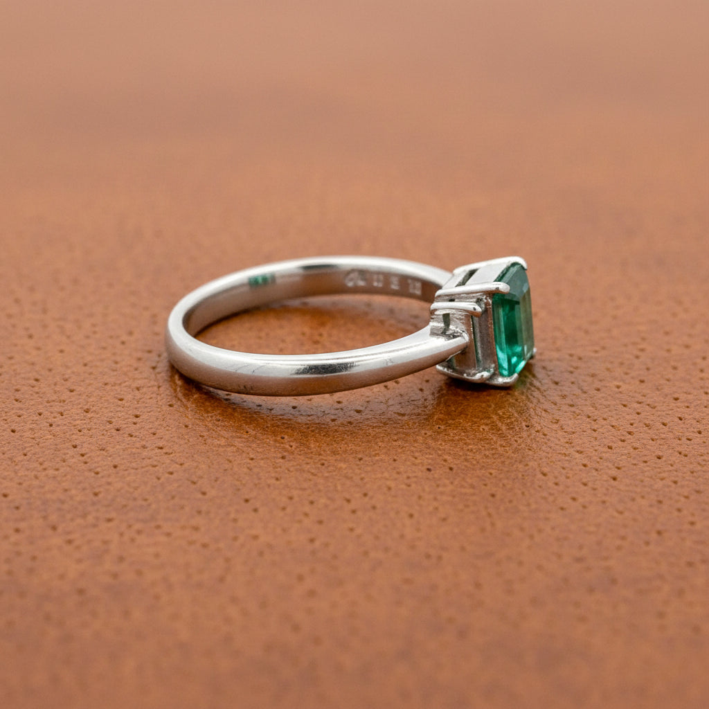 Estate Ring, 2 Baguette Cut Diamond 0.12 cttw H-I VS,1 Emerald Emerald Cut 0.81 ct  Platinum 5.50g (All Weights Estimated)