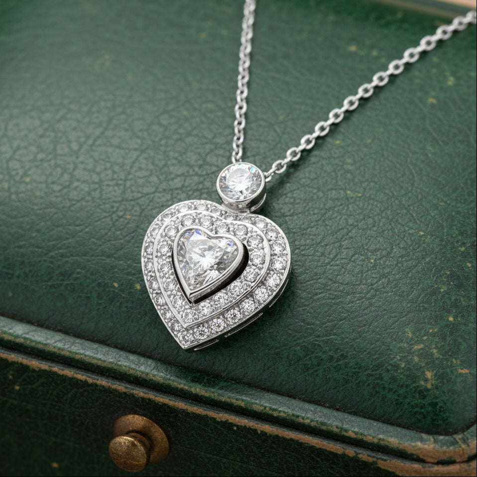 Estate Ring, 1 Heart Shape Diamond 0.80ct I SI1, 1 Round Brilliant Cut Diamond 0.25ct H SI2, 40 Round Brilliant Cut Diamond 0.50cttw H-I SI1-SI2, 14K White Gold 5.26g. All Weights Estimated.