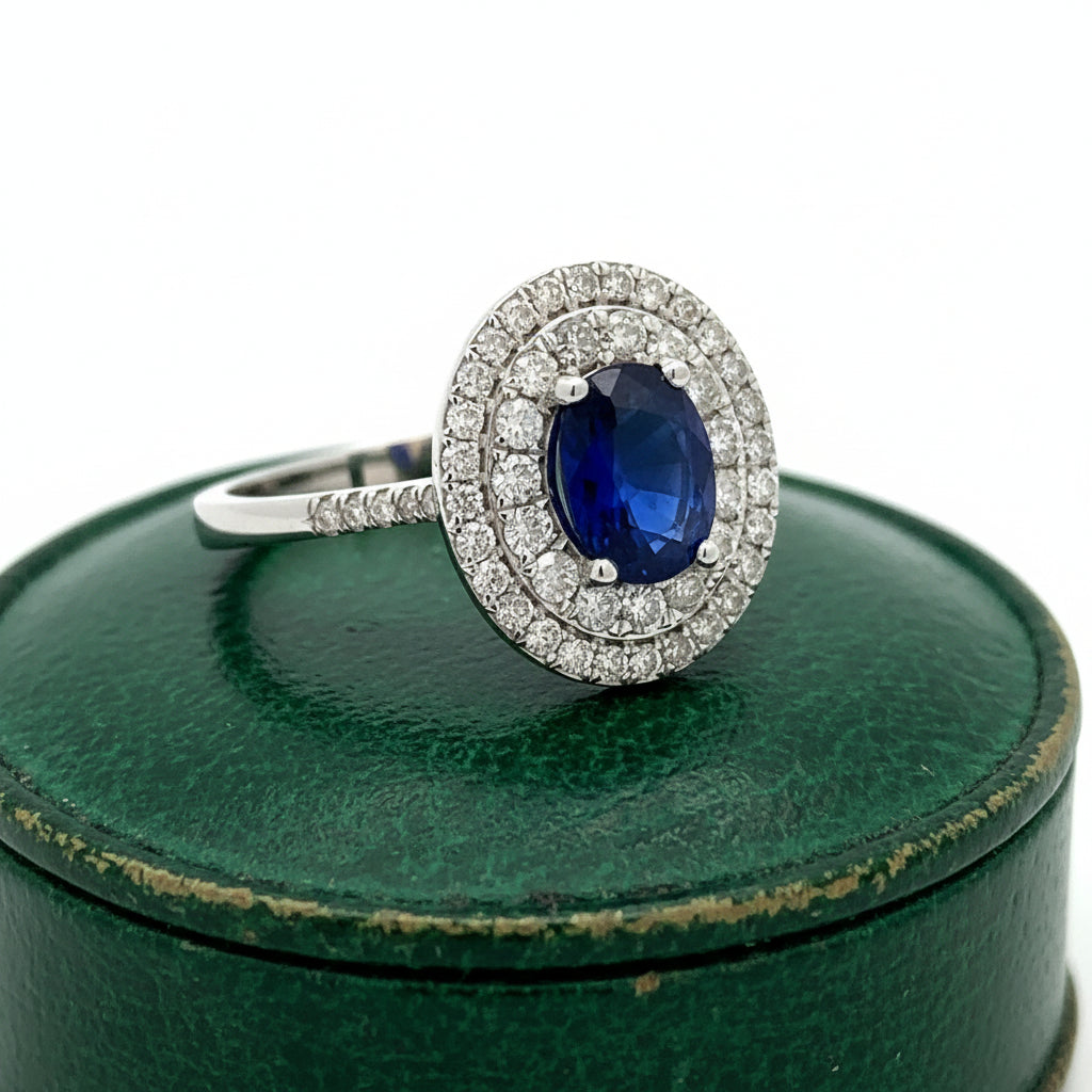 Estate Ring, Round Brilliant Cut Diamonds 0.70ct G-H VS2-SI, 1 Sapphire Oval 1.36ct, 14K White Gold 2.81g. All Weights Estimated.