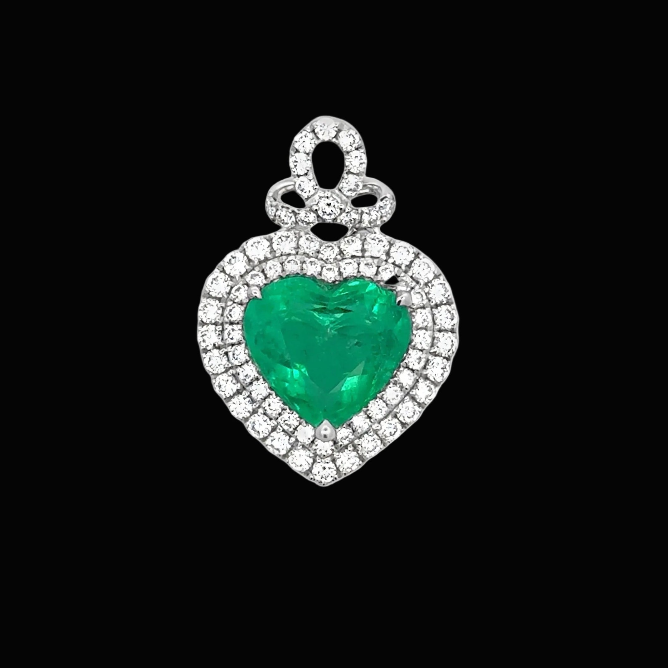 A.V. Pendant, 70 Round Brilliant Cut Diamond 2.72cttw G-H VS1-SI1, 1 Colombian Emerald Heart Shape 4.15ct  Clarity Enhanced F1 GIA #2235152265 14K White Gold 3.77g. All weights estimated.