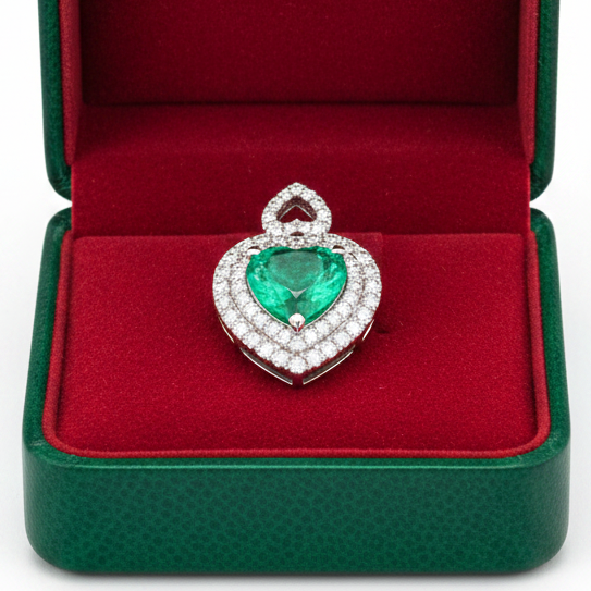 Designer A.V. Pendant, 61 Round Brilliant Cut Diamond 1.05 cttw  G-H VS1-SI1,1 Colombian Emerald Heart Shape 3.34 ct  Clarity Enhanced  F1 GIA #6234152270 14K White Gold 3.71g. All weights estimated.