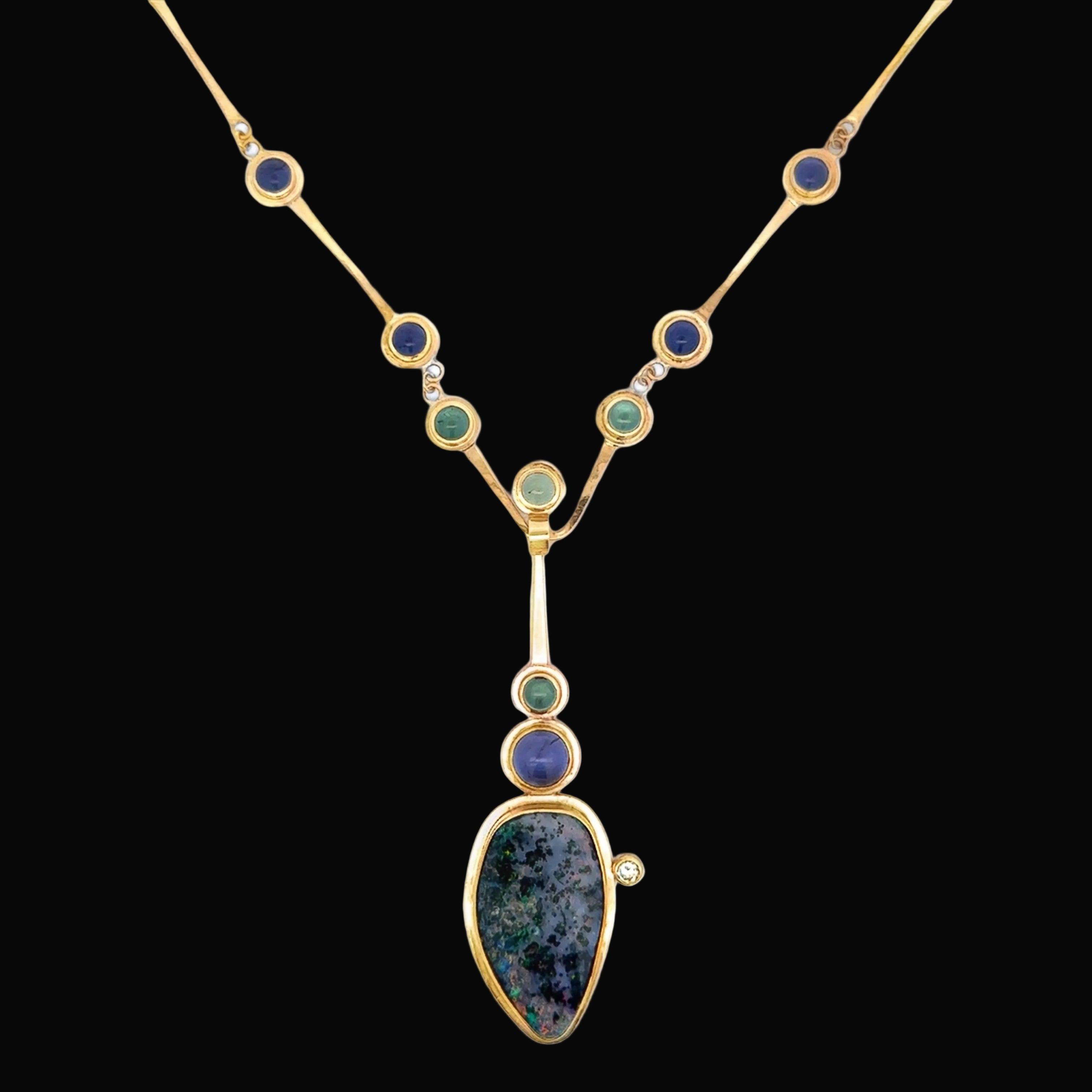 Designer Lee Philips Necklace, 1 Round Brilliant Cut Diamond 0.15ct  H SI1, Black Opal 31x34mm, 7 Iolite Cabochon 2.00 cttw, 4 Aquamarine Cabochon 1.00cttw,  14K Yellow Gold 26.27g. All weights estimated.