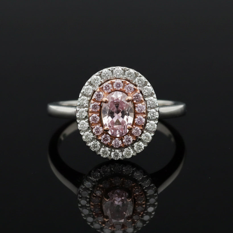 Estate Ring, 1 Oval Diamond .53ct  Fancy Purple-Pink I1 GIA #5182469614, 14 Round Brilliant Cut Diamond 0.12 cttw  Fancy Pink VS1-VS2, 20 Round Brilliant Cut Diamond G VS2-SI1 .20cttw. Platinum 6.63g. All Weights Estimated.