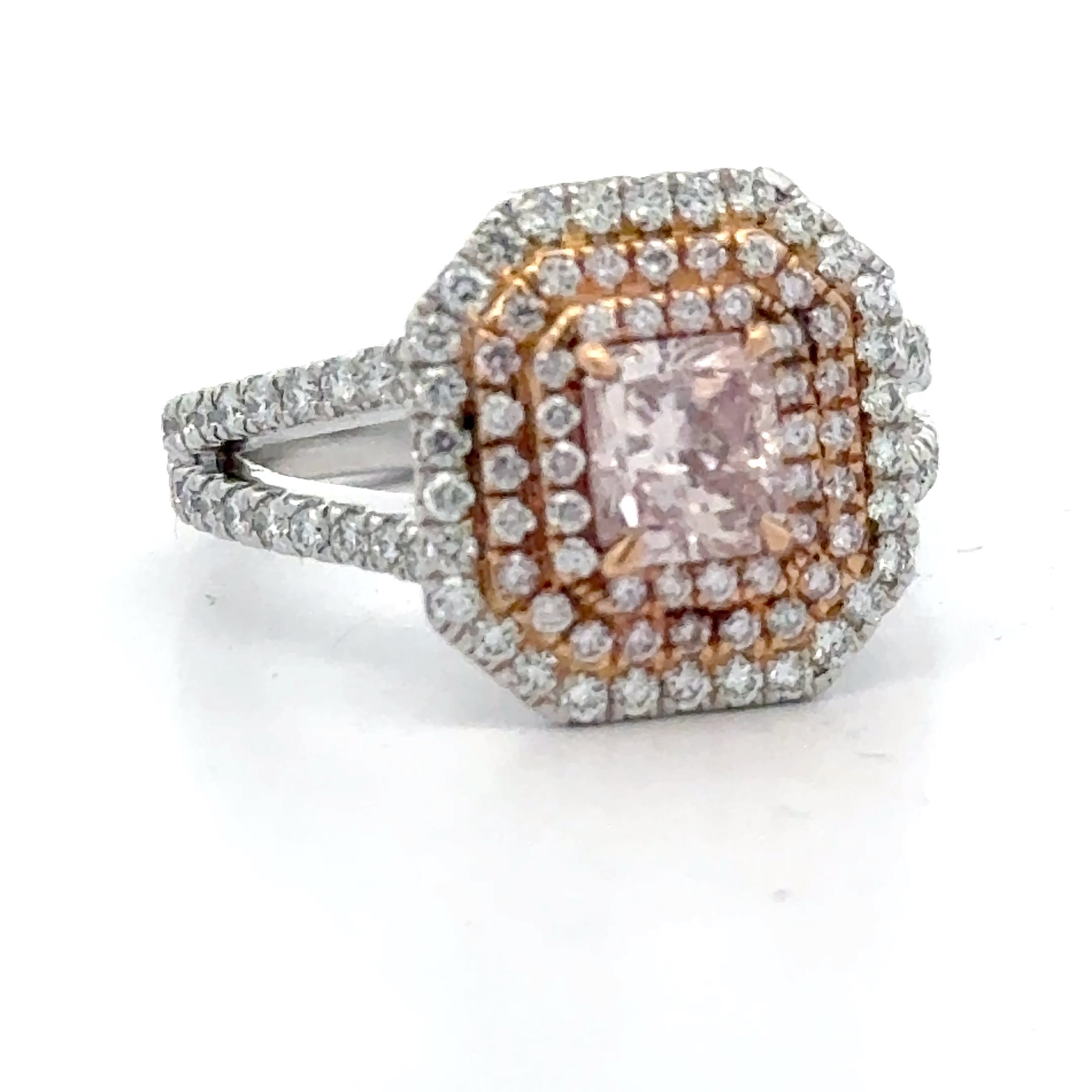 Estate Ring, 1 Radiant Cut Diamond 0.86 ct  Fancy Pink I1 GIA #6202759126, 42 Round Diamond 0.22 cttw  Fancy Pink VS2-SI1, 50 Round Diamond 0.65 cttw  G-H VS2-SI1 Platinum/18K Rose Gold 8.91g. All Weights Estimated.