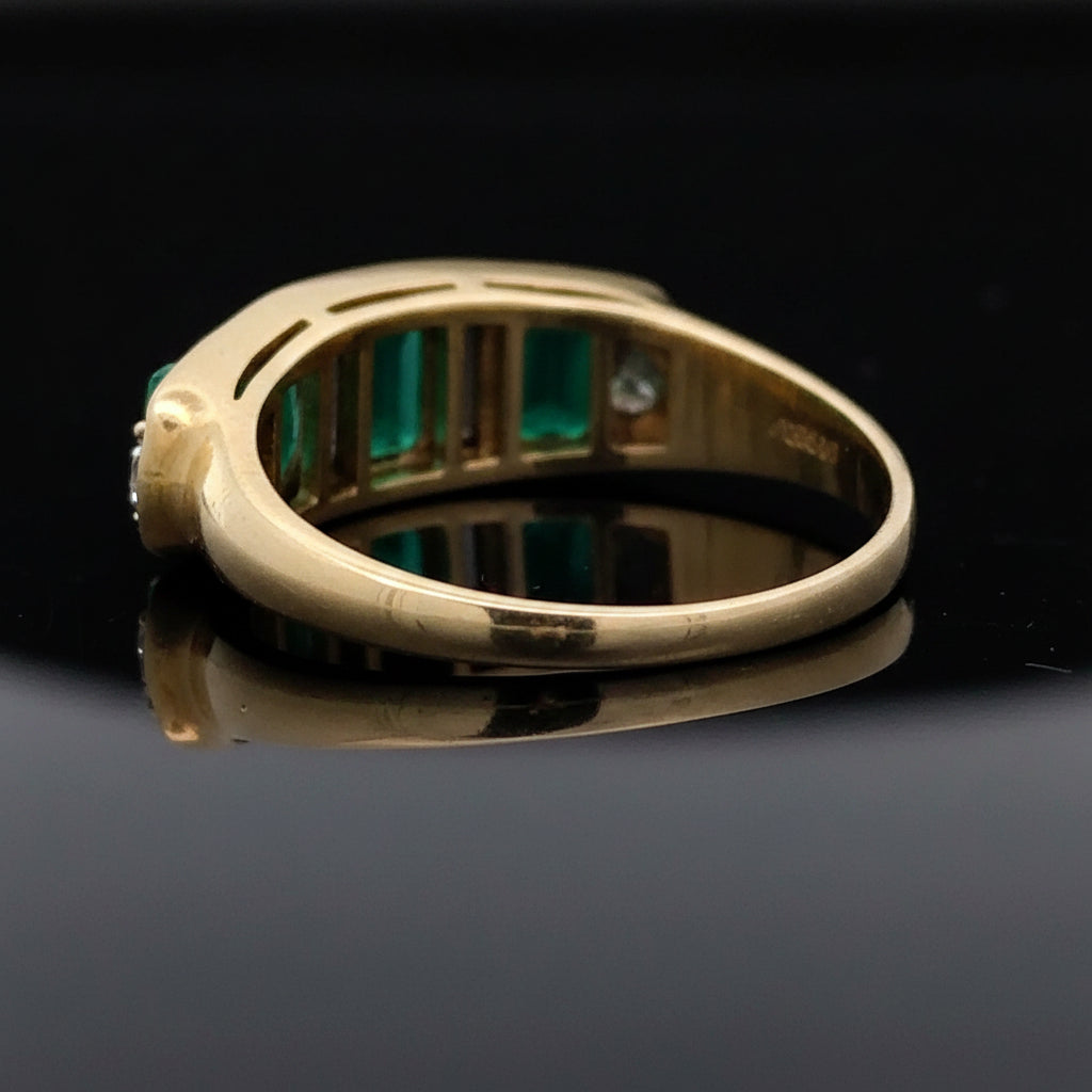 Estate Ring, 2 Tapered Baguette Cut Diamond and 2 Cadillac Cut Diamond 1.02 cttw  VS2-SI1, 3 Fine Emerald Cushion Cut 2.40 cttw  Green 18K Yellow Gold 6.94g. All Weights Estimated.