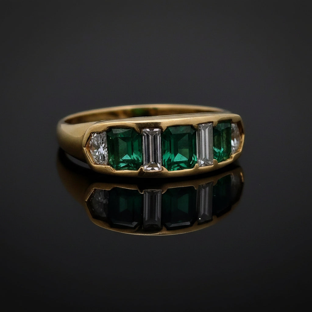 Estate Ring, 2 Tapered Baguette Cut Diamond and 2 Cadillac Cut Diamond 1.02 cttw  VS2-SI1, 3 Fine Emerald Cushion Cut 2.40 cttw  Green 18K Yellow Gold 6.94g. All Weights Estimated.