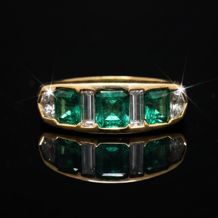 Estate Ring, 2 Tapered Baguette Cut Diamond and 2 Cadillac Cut Diamond 1.02 cttw  VS2-SI1, 3 Fine Emerald Cushion Cut 2.40 cttw  Green 18K Yellow Gold 6.94g. All Weights Estimated.