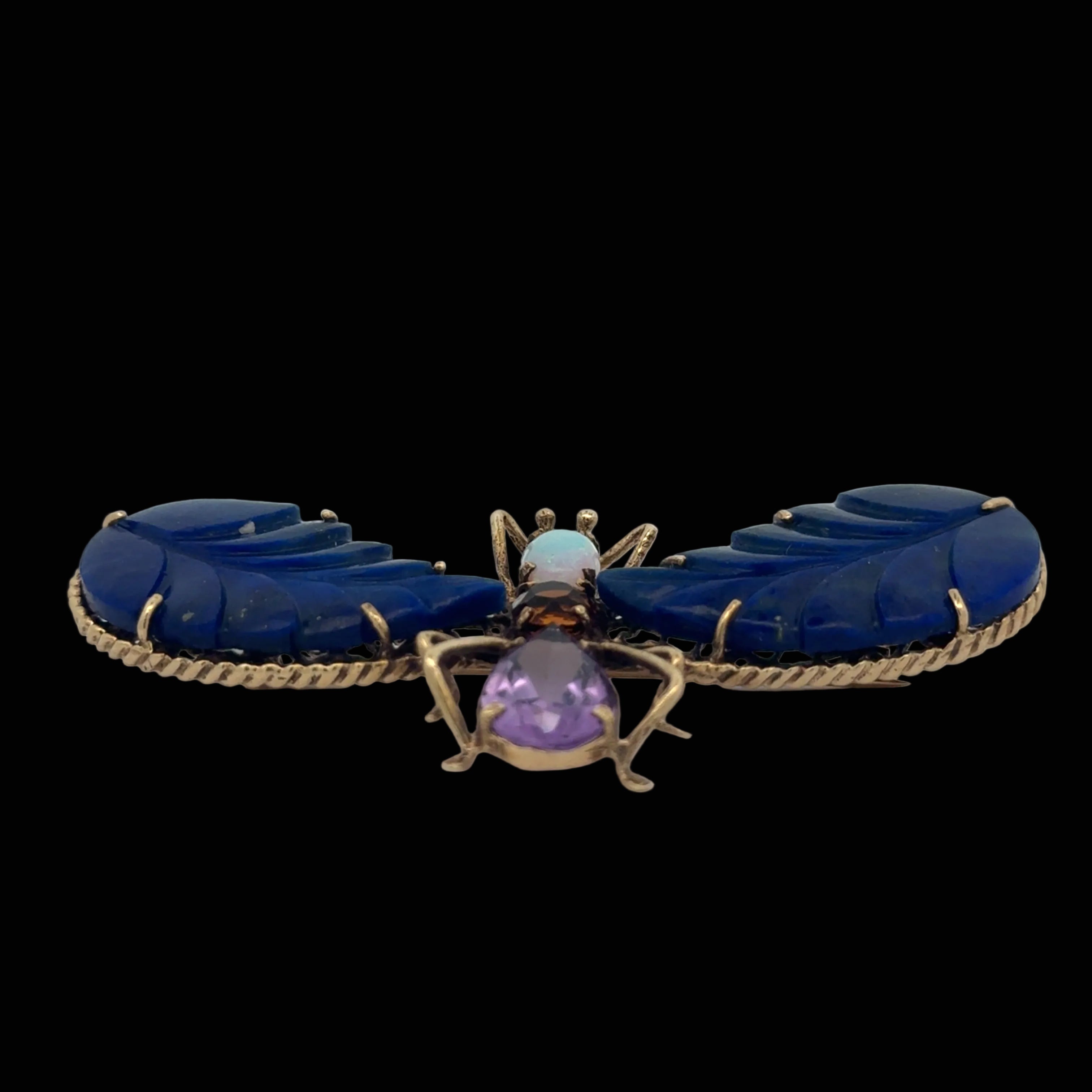 Estate Brooch/Pendant,1 Opal Cabochon 0.60 ct , 1 Amethyst Pear Shape 3.00 ct , 2 Carved Lapis Lazuli, 1 Citrine Round 0.50 ct  14K Yellow Gold 14.10g. All Weights Estimated.