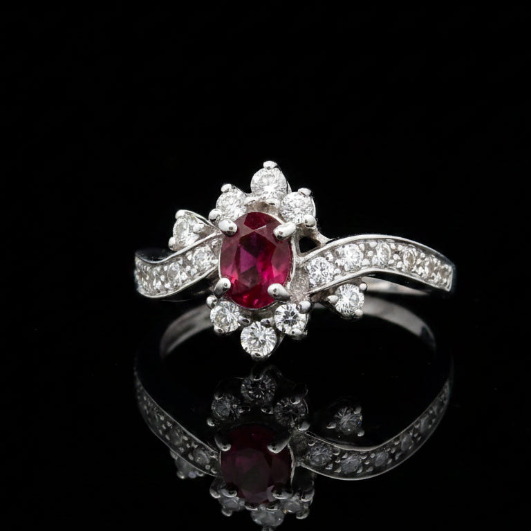 Estate Ring, 20 Round Brilliant Cut Diamond 0.25 cttw  G-H VS1-SI1,1 Ruby Oval 0.51 ct  18K White Gold 3.76g. All Weights Estimated.