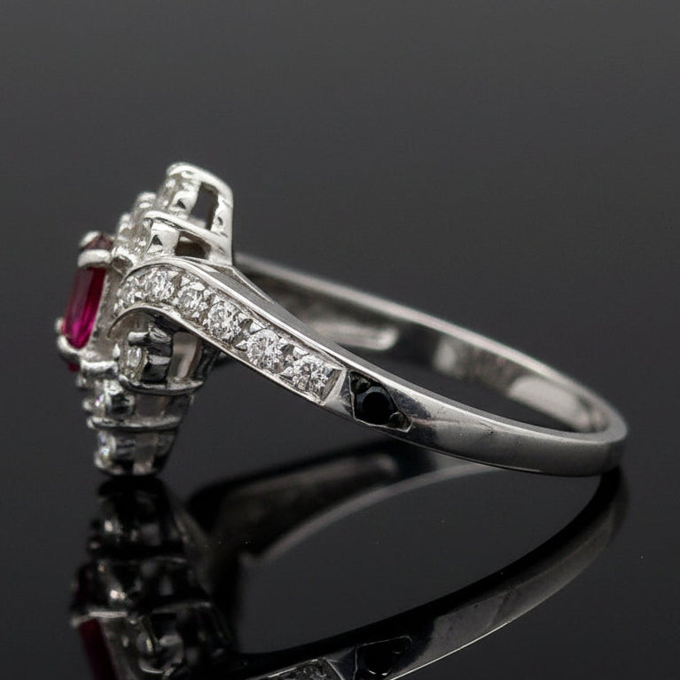 Estate Ring, 20 Round Brilliant Cut Diamond 0.25 cttw  G-H VS1-SI1,1 Ruby Oval 0.51 ct  18K White Gold 3.76g. All Weights Estimated.