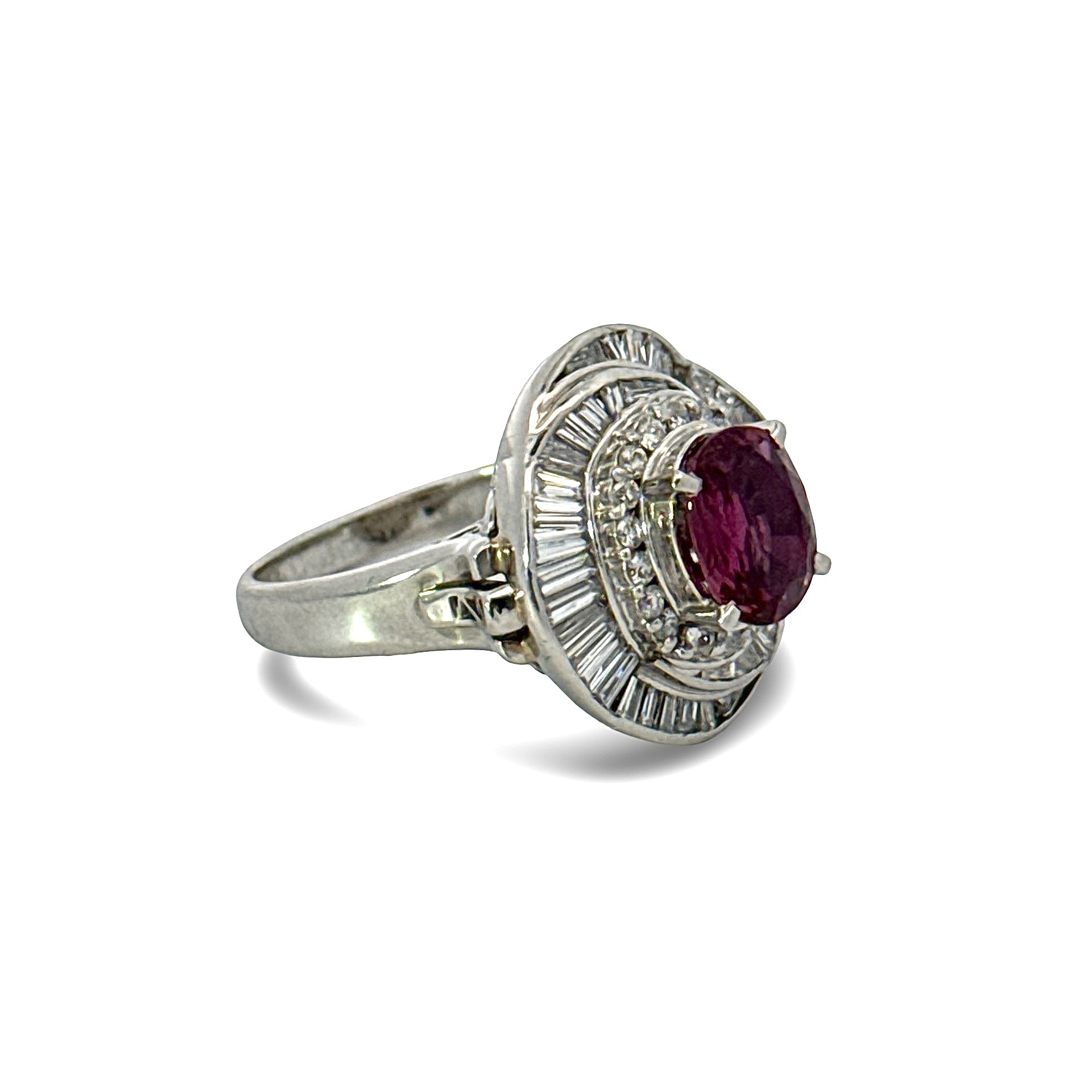 Estate Ring, Round/Baguette Cut Diamonds 1.28cttw G-H VS1-SI1,1 Ruby Oval 1.70ct,  Platinum 13.85g. Weights are estimated.