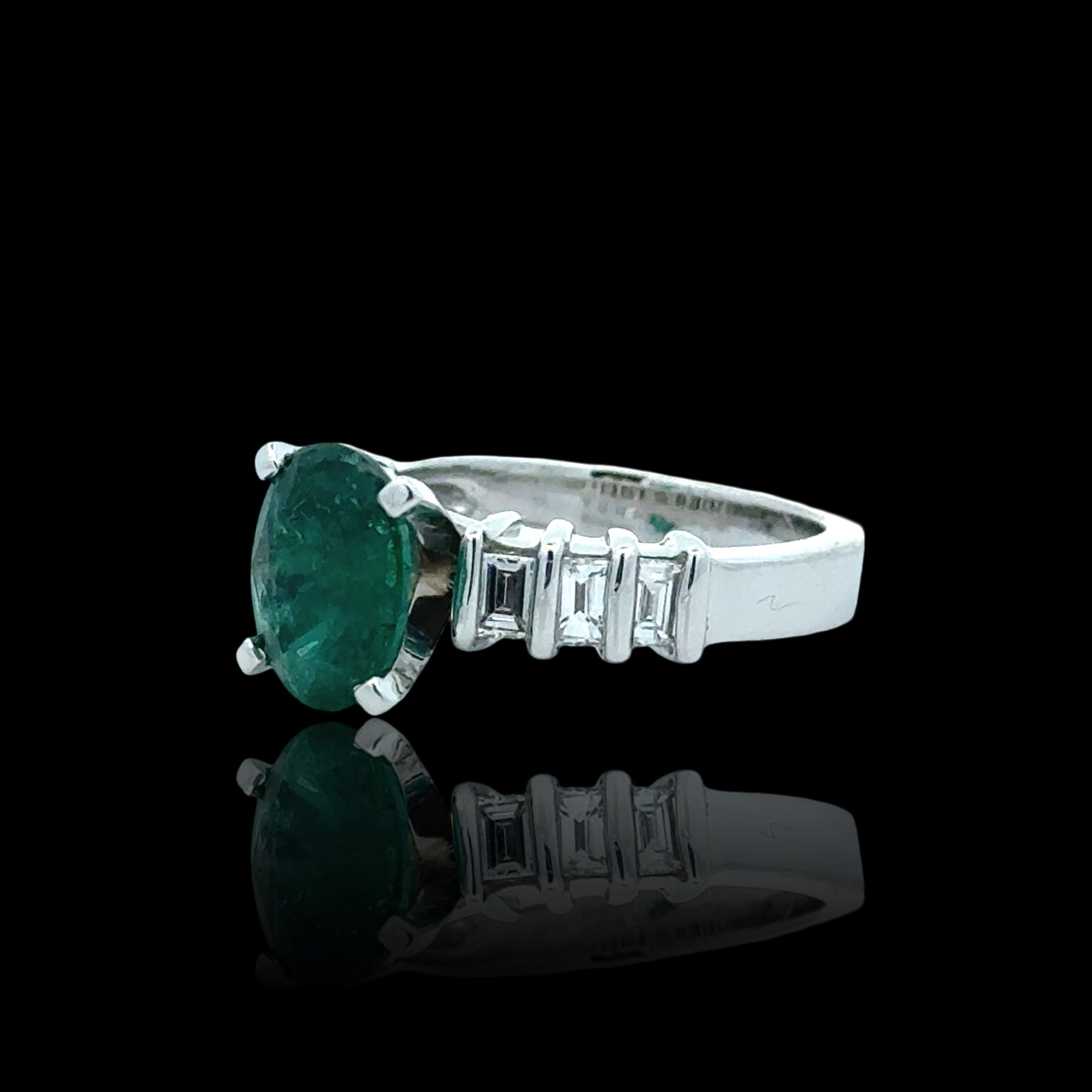 Estate Ring, 1 Emerald Oval 2.35 ct, 6 Baguette Cut Diamond 0.78 ct  G-H VS1-SI1,  Platinum 10.13g. Size 6.75