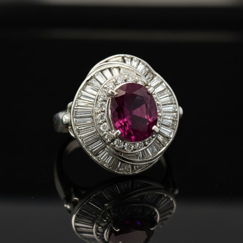 Estate Ring, Round/Baguette Cut Diamonds 1.28cttw G-H VS1-SI1,1 Ruby Oval 1.70ct,  Platinum 13.85g. Weights are estimated.