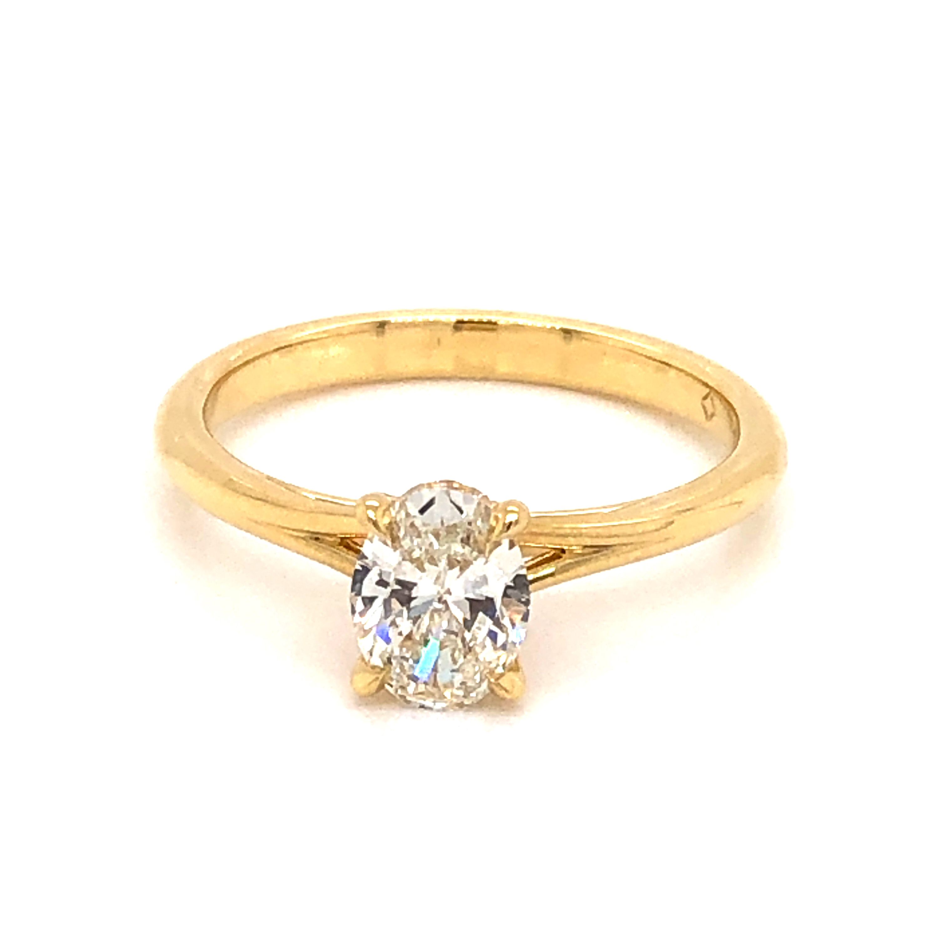 18 Karat yellow gold engagement ring Size 6.5 with One 0.70Ct Oval J VS2 Diamond and 14=0.04ctw Round Brilliant G VS Diamonds  dwt: 2