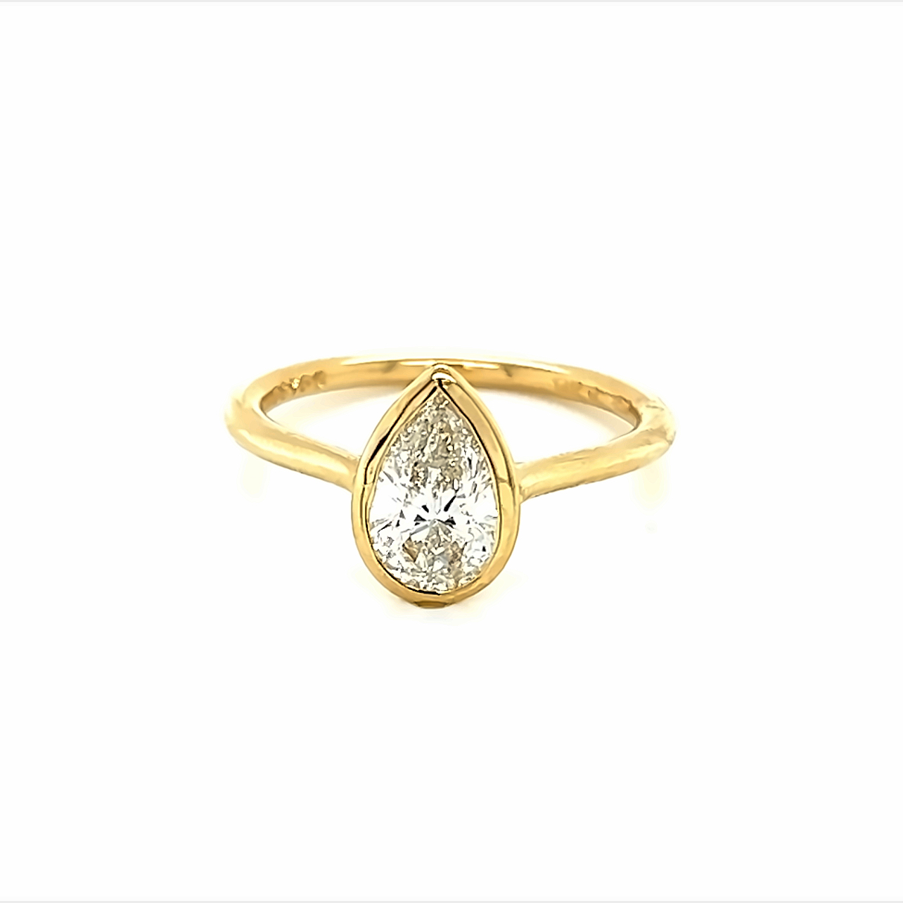 14 Karat yellow gold bezel set engagement ring with one1.01ct Pear G SI2 Diamond
