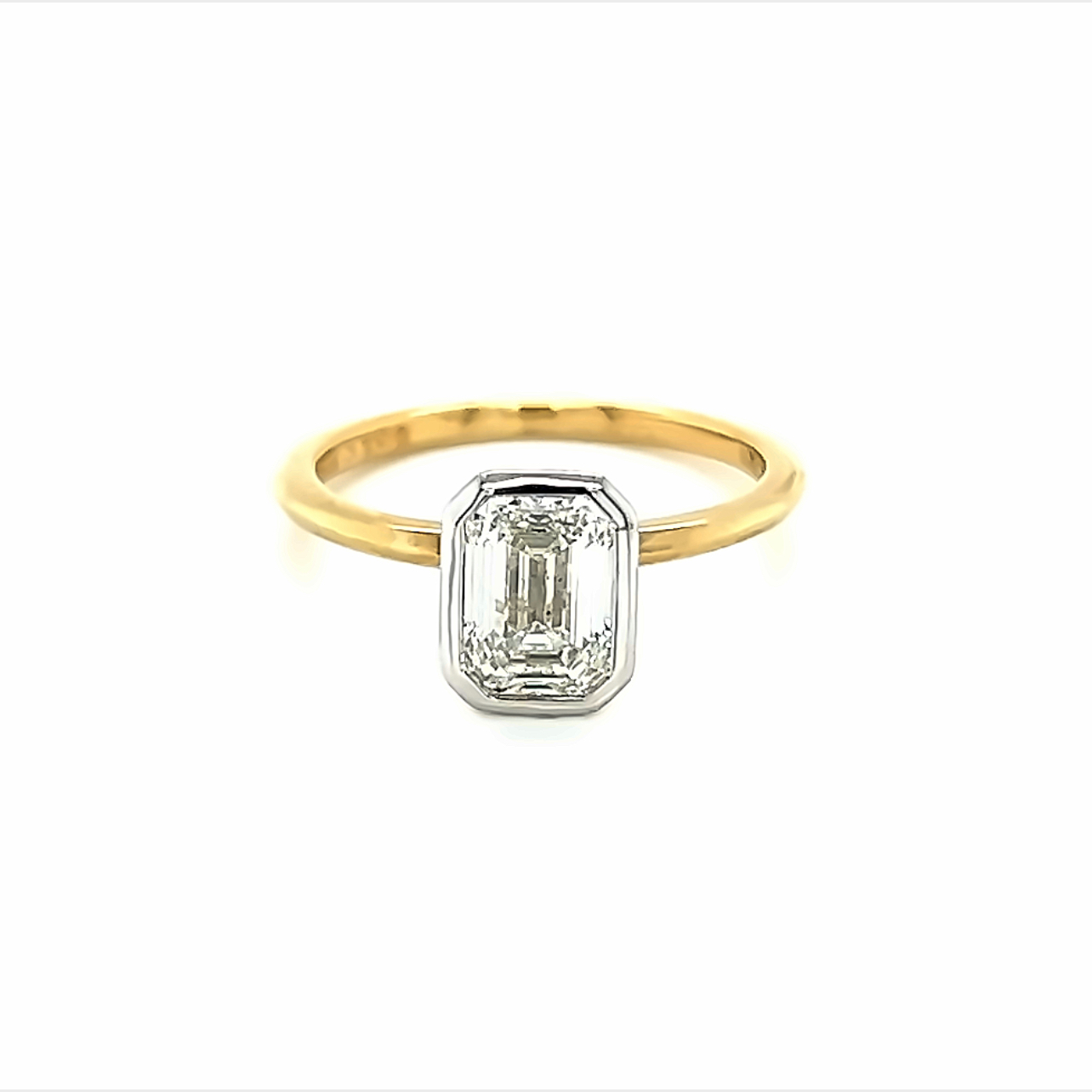 14 Karat yellow gold engagement ring with one1.26ct Emerald I SI1 Diamond bezel set in 14 karat white gold