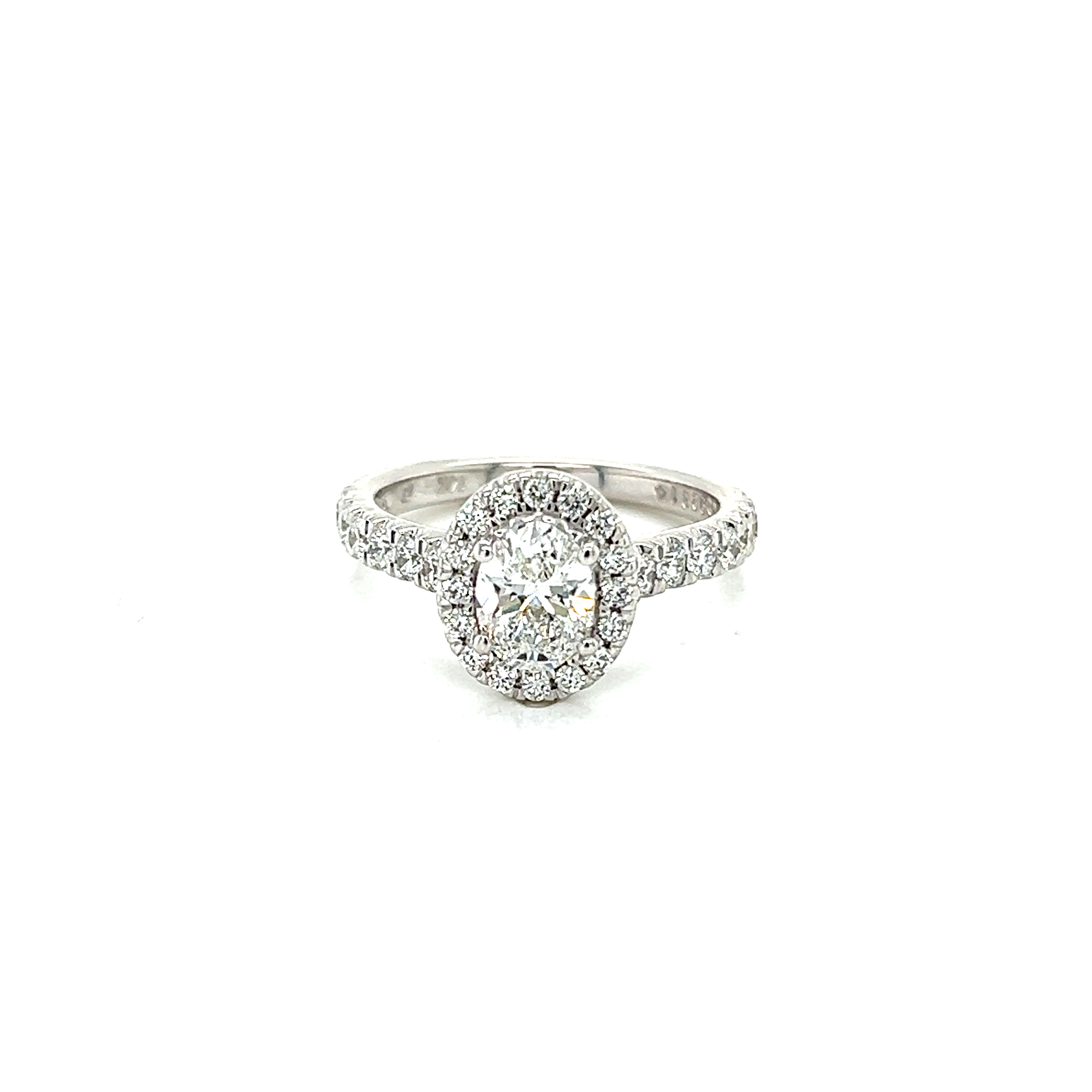 14 Karat white gold engagement ring with One 0.82Ct oval E SI2 Diamond and 38=0.71Tw Round Brilliant E SI Diamonds