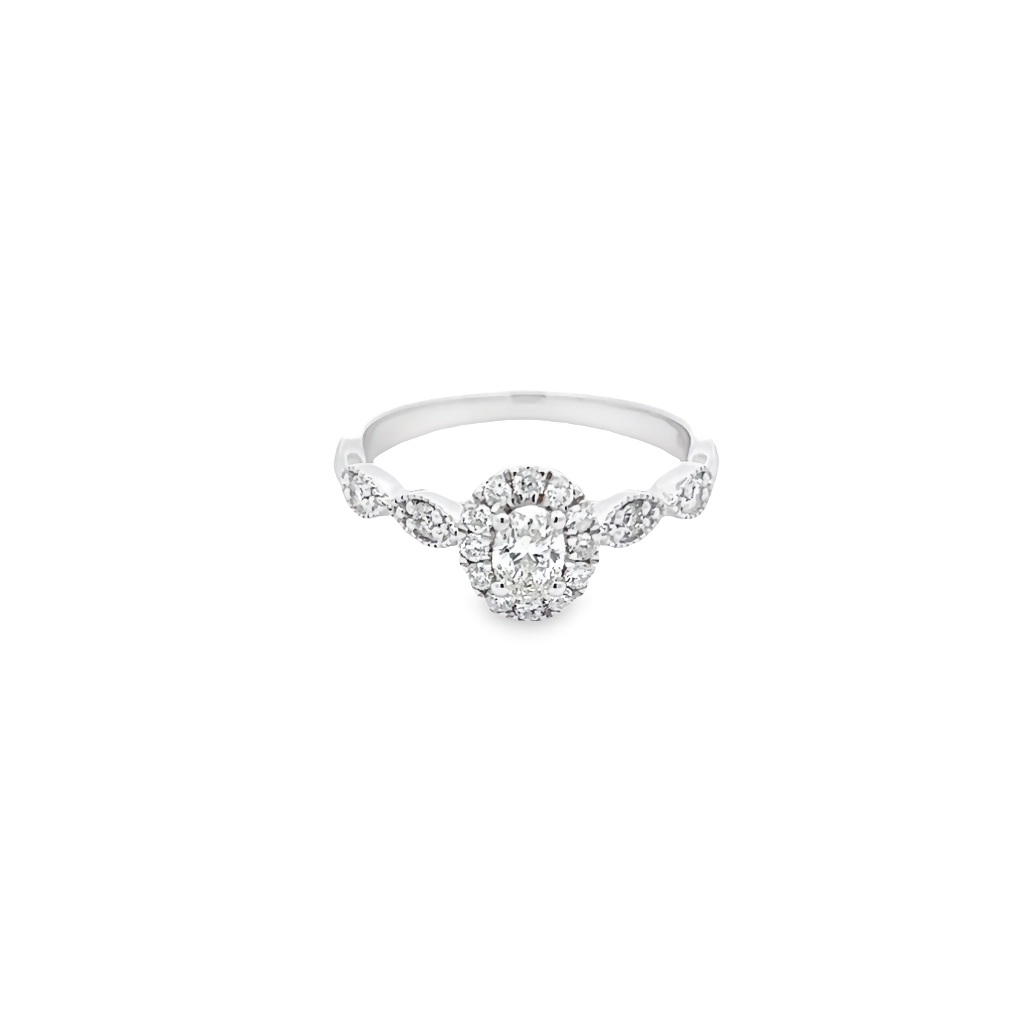 14 Karat white gold engagement ring with One 0.15Ct oval K SI1 Diamond and 16=0.35 total weight round brilliant G SI Diamonds