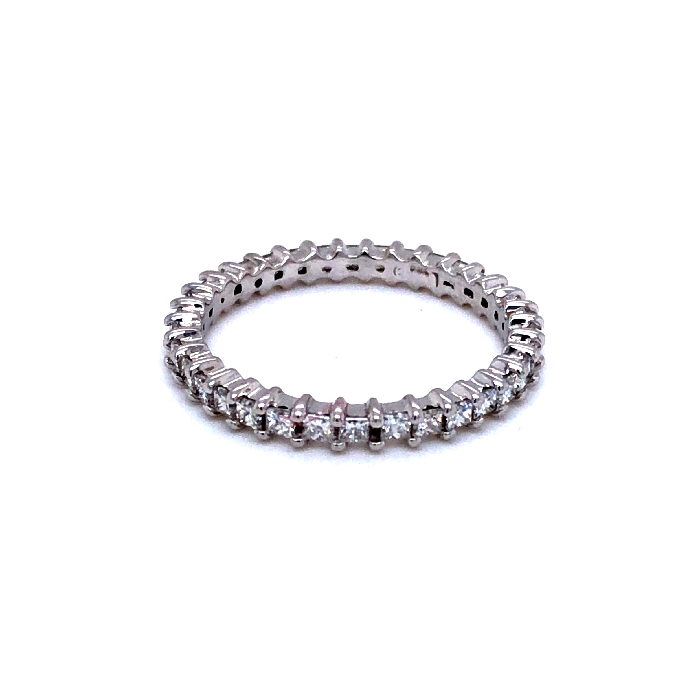 14 Karat white gold eternity wedding band with 34=0.85tw Princess G VS Diamonds