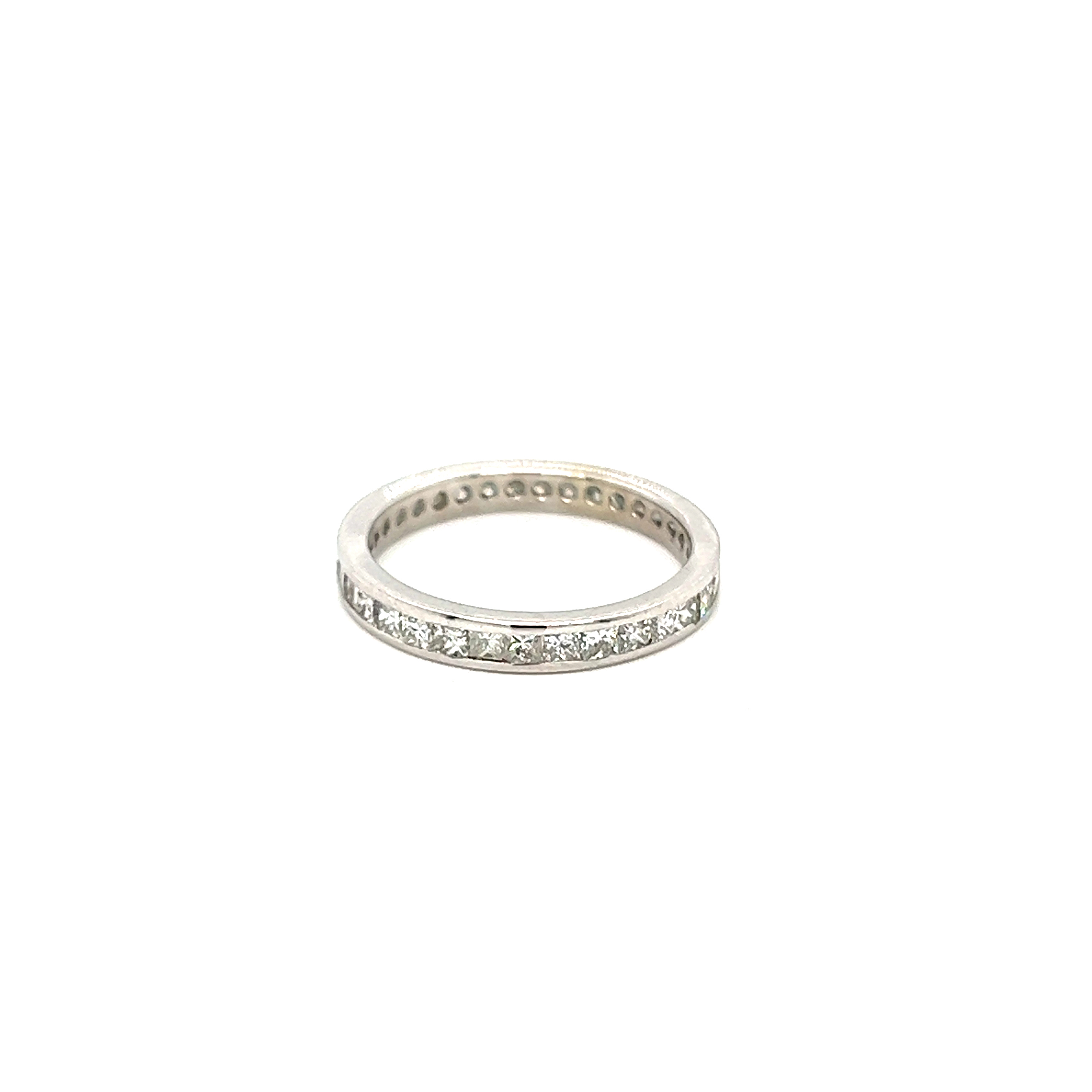 14 Karat white gold eternity wedding band with 34=1.00tw Princess G SI Diamonds.