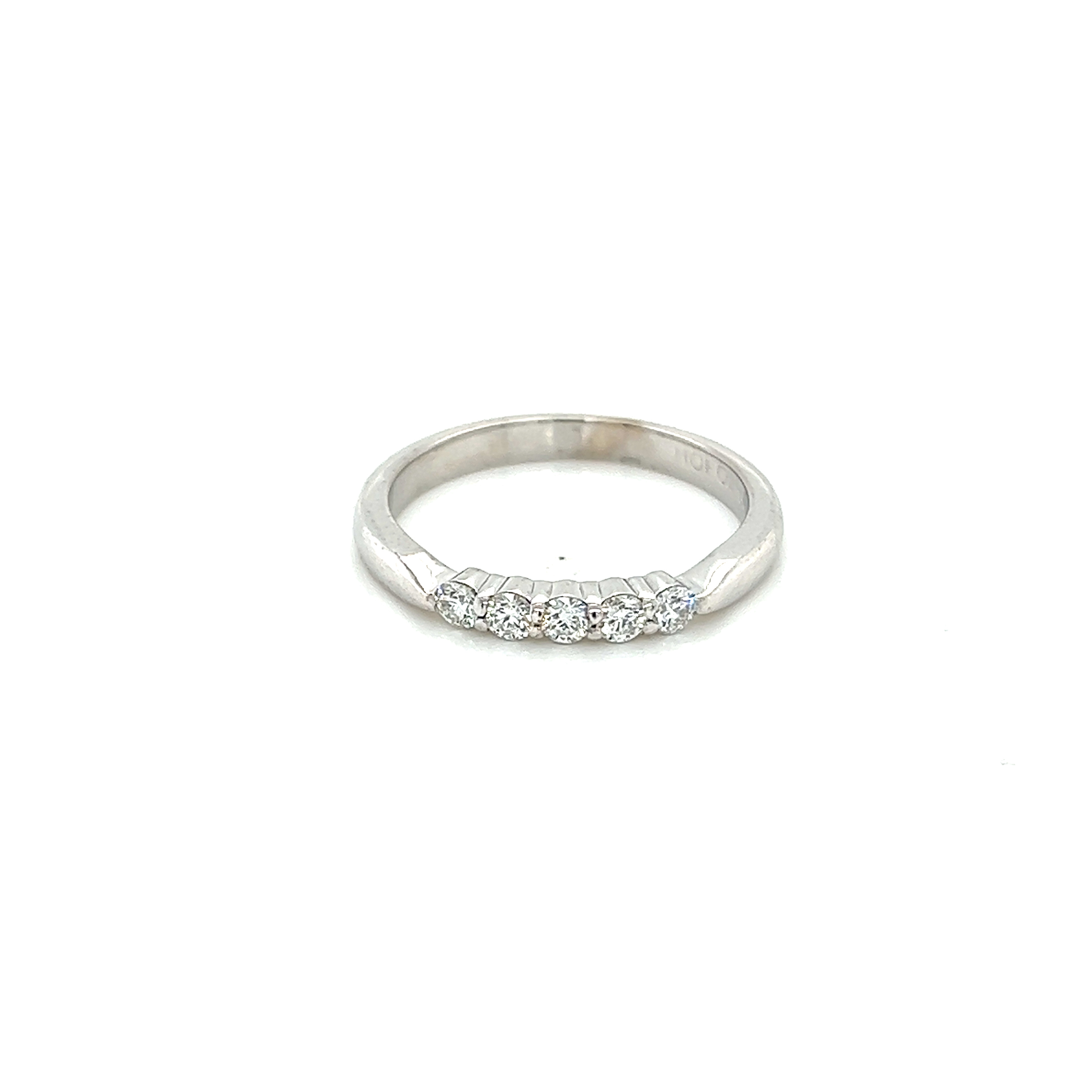 18 Karat white gold wedding band with 5=0.25tw Round Brilliant F VS Diamonds