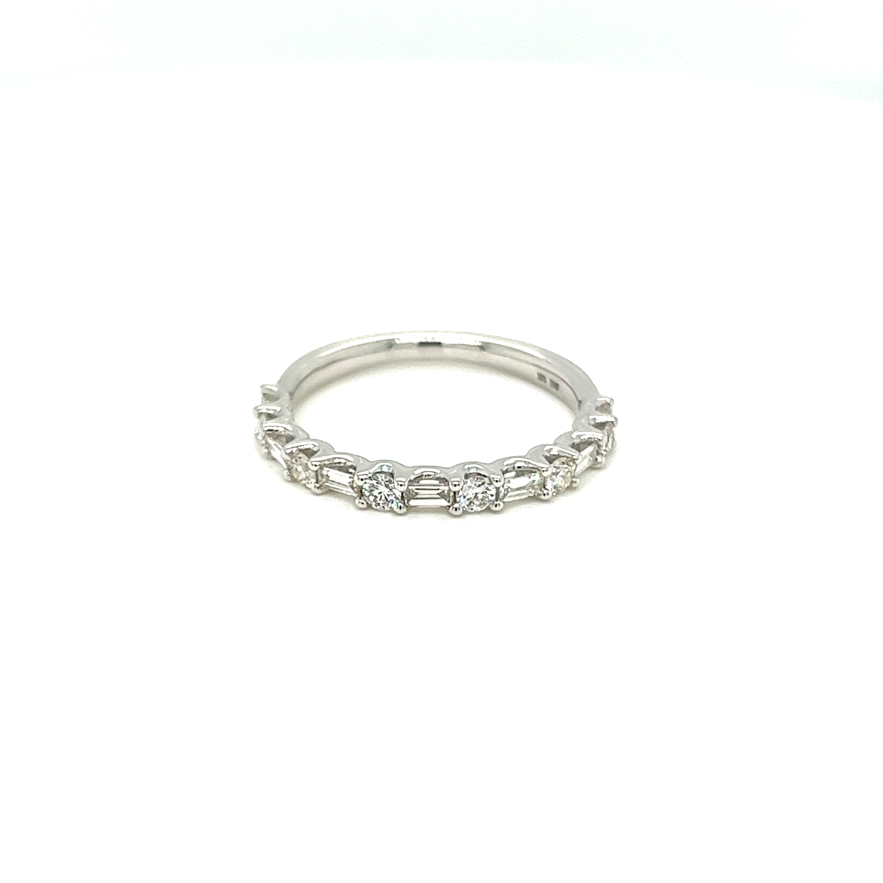 14 Karat white gold wedding band Size 6.25 with 7 baguette diamonds and 6 round brilliant diamonds with total carat weight of .50 with G color and VS clarity.