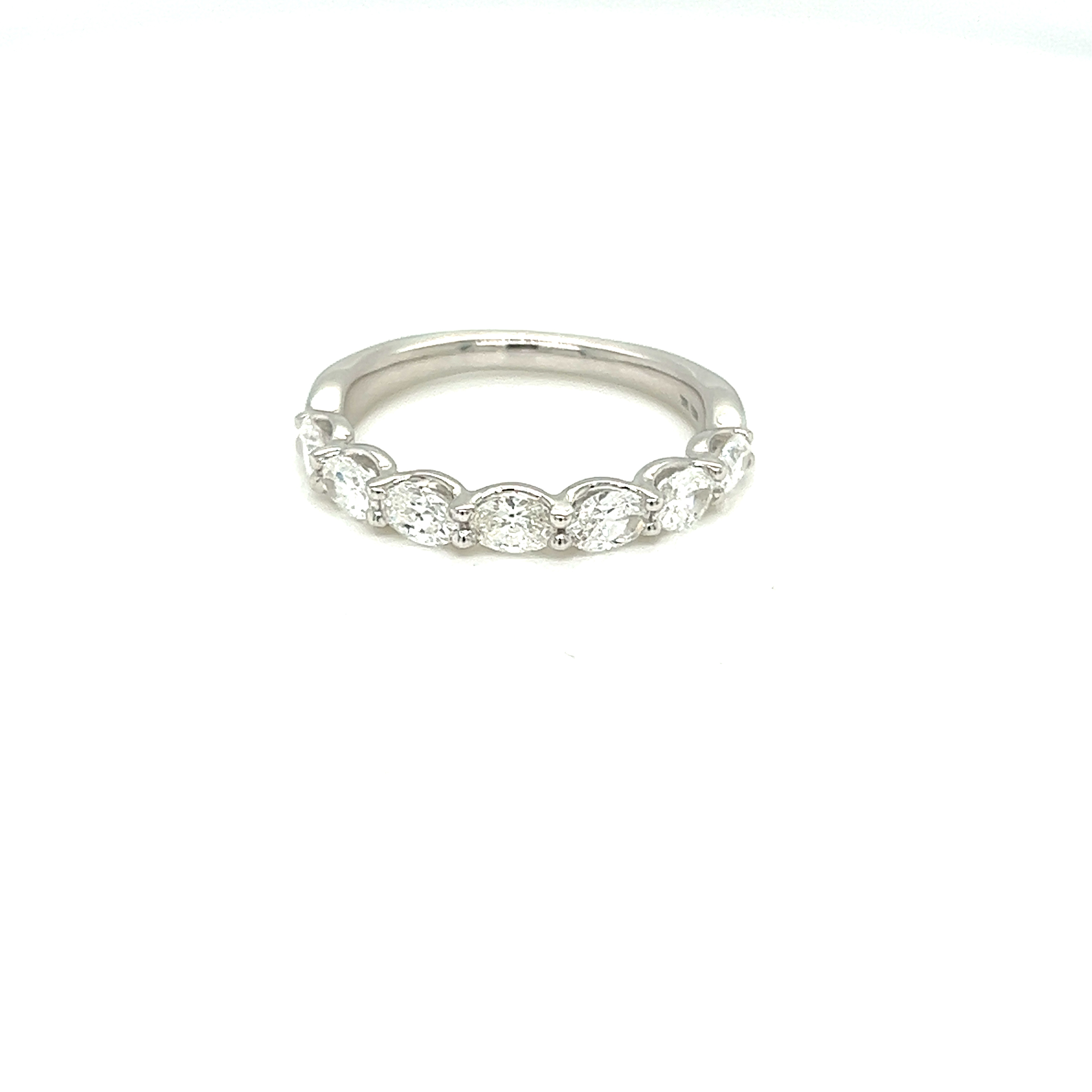 14 Karat white gold wedding band with  7=1.05tw Oval G VS Diamonds