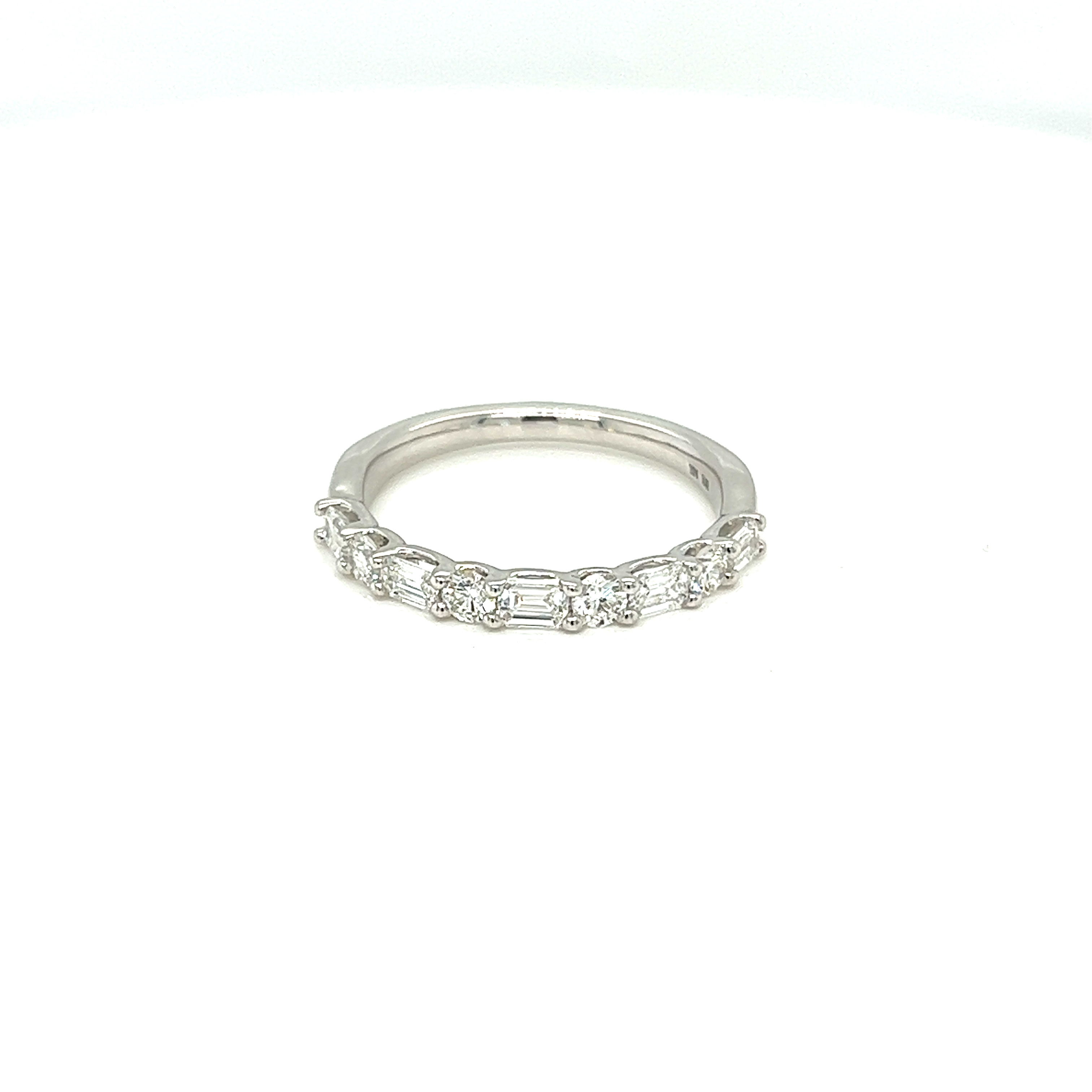 14 Karat white gold Wedding Band with 5 baguette diamonds and 4 round brilliant diamonds with a total weight of .75 carats with  G color and Vs clarity