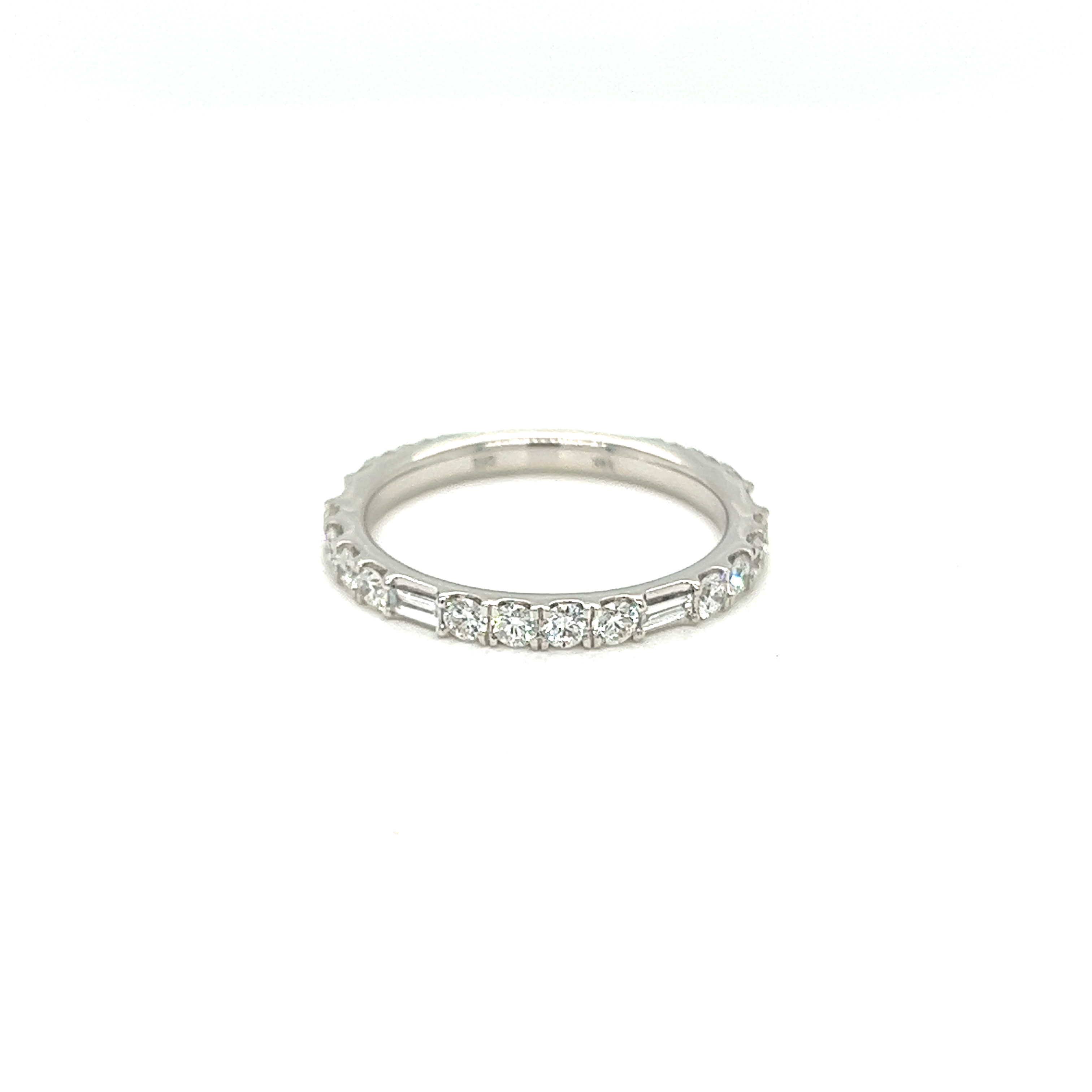 14 Karat white gold wedding band Size 6.5 with18 round brilliant diamonds and 4 baguette dimaonds for a total cart weight ot .80 with G color and  VS clarity